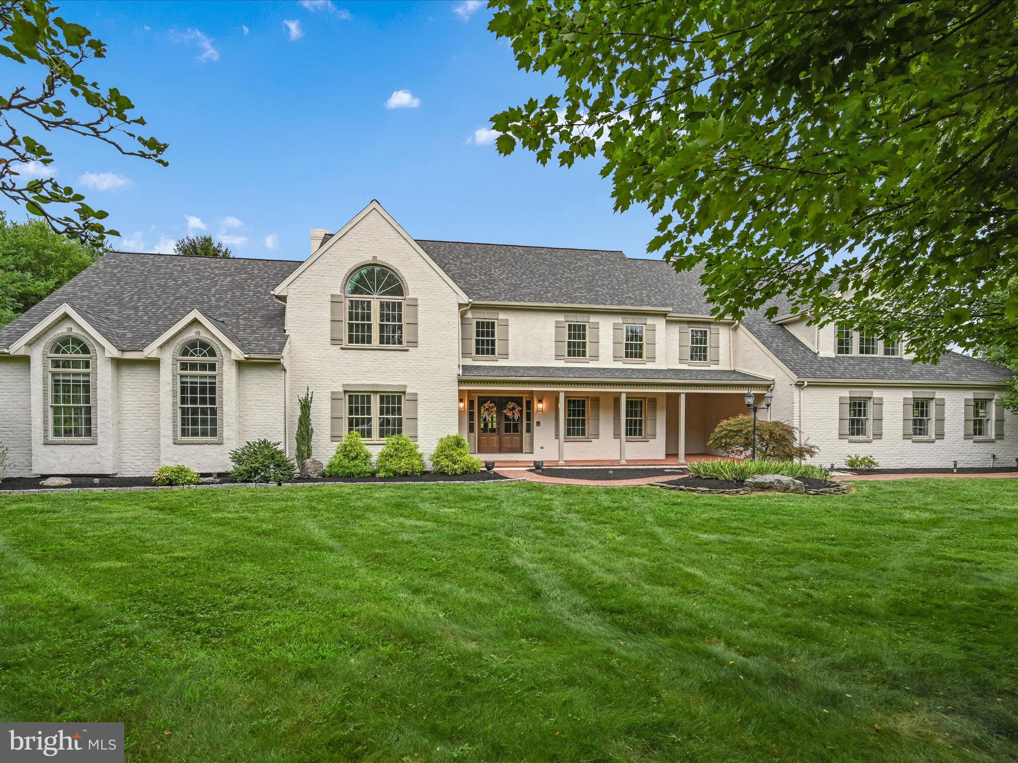 OPEN HOUSE Sunday (9/1) 2-4pm. Your Dream Home awaits in Manheim Township's prestigious Stonehenge neighborhood!   This magnificent residence boasts nearly 6,500 square feet of luxurious living space, featuring 5 spacious bedrooms, 3.5 modern bathrooms and an abundance of space ideal for a growing family or hosting guests.   As you approach the double-door entry you will immediately notice the modern façade of the home which has undergone a recent facelift resulting in spectacular curb appeal.   Step inside to discover an updated interior featuring new flooring and fresh paint throughout the home.   The neutral tones and overall design serve as a perfect backdrop and will complement any decor.   To the right of the foyer, you will be greeted by an expanded kitchen with two generous islands with quartz countertops, new stainless-steel appliances including a double wall oven, and a cozy breakfast room with a brick wood-burning fireplace. This is truly the heart of the home.  Adjacent to the kitchen, the bright sunroom offers a perfect spot for morning coffee.  The family room, complete with a wet bar, a second brick fireplace and a huge bay window serves as a cozy place to relax while the Grand entertaining area awaits through the double doors.  You will be in awe of the spaciousness of the room, which features sky-high windows and a soaring cathedral ceiling.  It is the ideal space for large gatherings with family and friends.   The first floor also includes a convenient laundry room off the kitchen and a versatile bonus room in the rear of the home, ideal for a home gym or game room.   This sprawling home offers two sets of stairs to the second floor which leads to five oversized bedrooms and three full baths. The primary suite is a true retreat, featuring a vaulted ceiling, a massive walk-in closet with custom organizers, and convenient laundry hookups. The primary bath offers two separate vanities, a gorgeous walk-in tiled shower with a skylight, and a second walk-in closet.  The home also includes a vast unfinished basement with endless possibilities, an oversized three-car garage, and an expansive driveway that offers plenty of parking. The large, level backyard and spacious brick patio off the sunroom is perfect for outdoor activities and relaxation.  This home is simply a must-see!  Schedule your private tour today!
