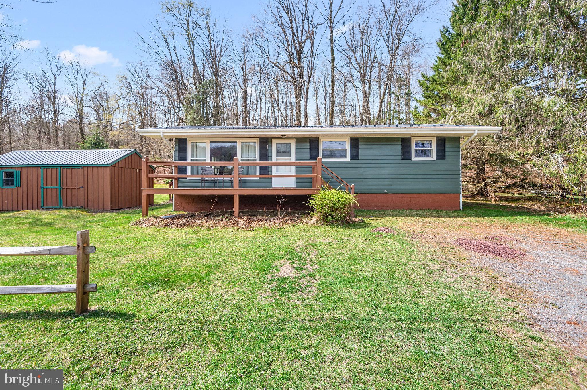 Lakeside Wyanooska Ranch on 2.01 acres ! First time offered for sale  , This updated and well cared  home has been a family retreat  since 1967  and is ready for it's next chapter. Located at the end of dead end road and across from scenic Wynooska this home has an  inviting open-concept living area with warm wood accents, vaulted ceilings, and abundant natural light. Outside updates  include a 50 year metal roof, (2) trex decks,, and a newer septic. Inside updates include : vinyl plank flooring,replacement windows, mini split AC & Heat , updated kitchen w/ stainless steel appliances and new cabinetry and updated bathroom - Enjoy great views of Wyanooska Lake from the front  trex deck or enjoy nature views from the deck in the rear, Whether you’re seeking a full-time residence or a weekend escape,  this cozy lake-area retreat delivers and as a bonus- comes completely furnished!
Total acreage is 2.01 - includes  (3)  lots . 1) Main lot w/house  .33 ac  Lot #2 is 1.00 ac  hillside lot behind home and #3 - .68 acres located to the the left of the home and is already perced for septic . Come see this great lakeside property today before it's too late!  live video tour (including aerials at Youtube and enter 133 Wynooska into the search box