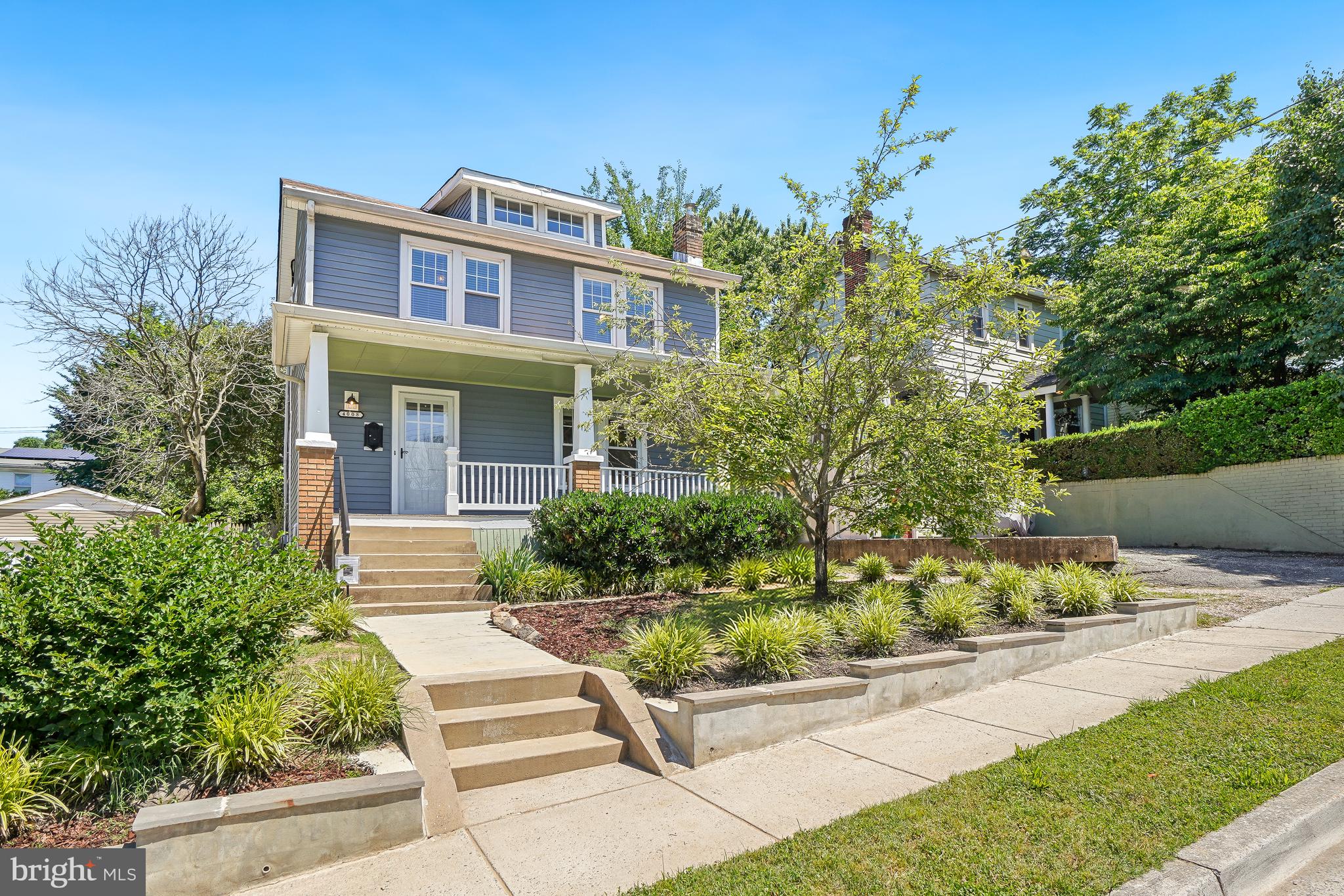 JUST LISTED and nestled on a tree-lined street in the heart of vibrant Hyattsville, 4008 Ingraham Street blends timeless character, flexible living space, and an exceptional indoor-outdoor lifestyle just moments from the best of the Route 1 corridor. Enjoy easy access to neighborhood favorites including the Arts District Hyattsville, Riverdale Park Station, Whole Foods, Vigilante Coffee, Franklins, local breweries, parks, trails, and community events that make this close-in location such a special place to call home. Just down the block, residents enjoy convenient access to Driskell Community Park featuring a community swimming pool, tennis courts, playgrounds, and outdoor recreation amenities. Commuters will appreciate easy access to Washington, DC, Metro, MARC, and major transportation routes while still enjoying the feel of an established residential neighborhood filled with mature trees and classic architecture.

Classic American Foursquare architecture blends timeless curb appeal with generous proportions, original woodwork, and flexible living spaces rarely found in newer homes. A welcoming wide front porch with porch swing sets the tone for this charming and light-filled home. Inside, original woodwork, trim, built-ins, hardwood floors, and updated luxury vinyl plank flooring create warmth and character throughout. Separate living and dining rooms provide inviting everyday living and entertaining spaces, while the renovated kitchen features quartz stone countertops, stainless steel appliances, abundant light, and excellent flow to the outdoor living areas beyond.

The flexible layout includes four bedrooms and two-and-a-half bathrooms, highlighted by a spacious and versatile main-level suite with en suite bath and walk-in closet that functions beautifully as a primary bedroom, guest suite, family room, or multi-generational living space. Central air conditioning, mini split systems, and classic radiator heat provide year-round comfort and flexibility.

Outdoor spaces are equally impressive with a rear deck overlooking a spacious yard ideal for entertaining, gardening, play, or simply relaxing outdoors. The landscaped front yard includes a mature apple tree, while the large walk-in shed and full-footprint basement with interior and side entrances provide exceptional storage and utility space rarely found at this price point. Off-street parking completes the package.

A rare combination of charm, versatility, outdoor space, storage, and location in one of the region’s most connected and community-oriented neighborhoods.

Open Saturday and Sunday 1-3PM