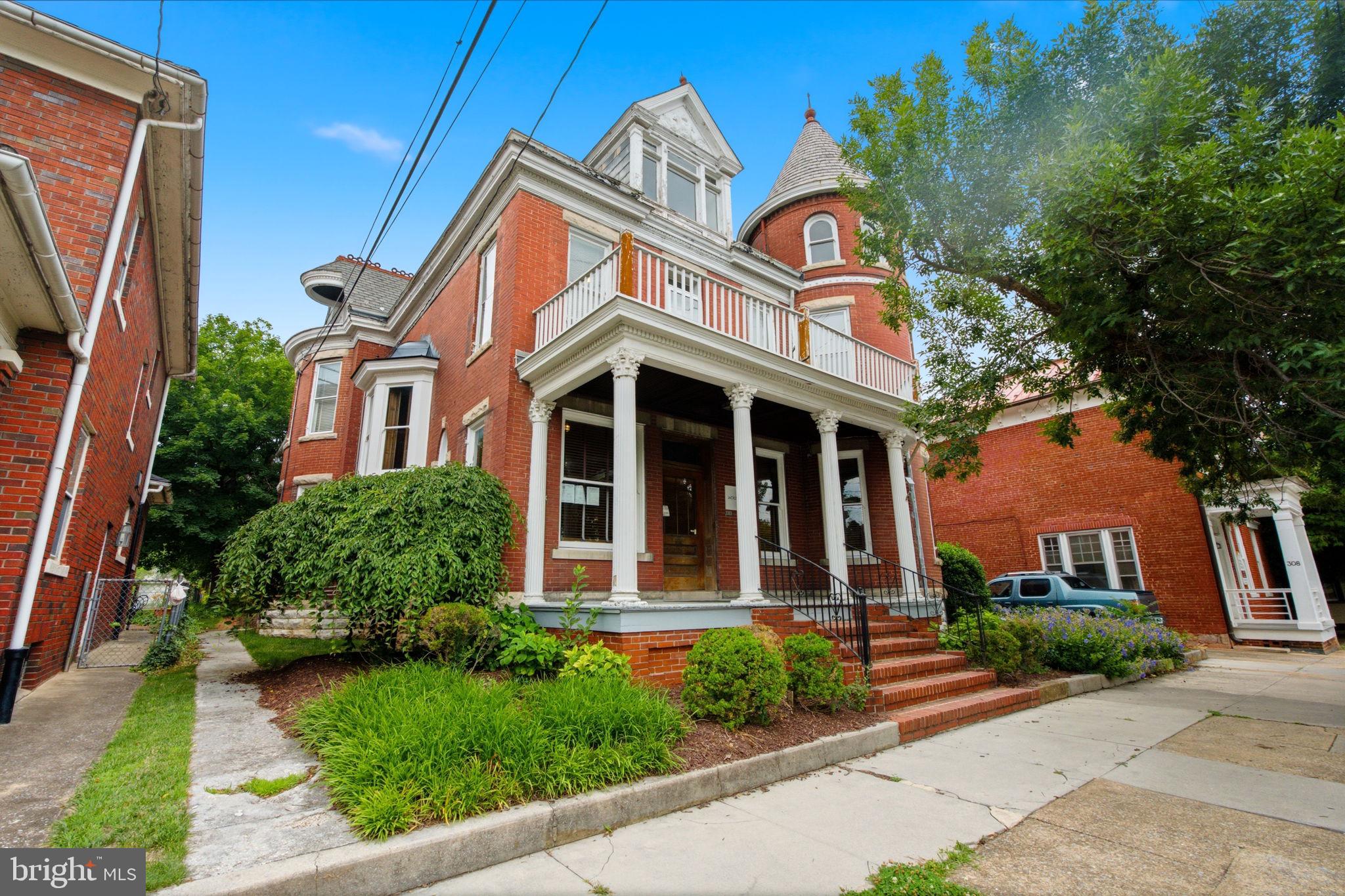 Timeless Historic Landmark – Residential Elegance or Prestigious Professional Office
Step into one of the area's finest examples of early 20th-century architecture. Built in 1905, this magnificent Queen Anne Victorian seamlessly blends historic craftsmanship with modern comfort and offers exceptional flexibility as either an elegant private residence or a distinguished professional office.
From the moment you enter the grand foyer, you'll be captivated by the soaring ceilings, stunning original woodwork, intricate millwork, pocket doors, stained-glass windows, glass transoms, and remarkable period details that have been lovingly preserved. The impressive corner turret, expansive front and rear porches, and breathtaking interior architecture create an unforgettable first impression.
The property features approximately nine potential bedrooms or private offices, making it ideal for a law firm, medical practice, financial services, nonprofit headquarters, or executive offices while easily converting back to an extraordinary single-family home.
Highlights include:
Six ornate fireplaces showcasing exceptional craftsmanship
Grand foyer with original pocket doors
Stunning carved wood mantels and architectural millwork throughout
Beautiful stained-glass windows and glass transoms over many doors
Tall ceilings and oversized rooms filled with natural light
Two full bathrooms (one on the first floor and one on the second floor)
Half bath on the third floor
Spacious third level offering additional offices, bedrooms, or flex space
Full basement providing exceptional storage or future expansion possibilities
Natural gas heat and central air conditioning throughout
Fire sprinkler system
Expansive front and rear porches
Outstanding curb appeal highlighted by the iconic turret and classic Victorian design
Whether you're searching for a signature business location that reflects success and professionalism or a one-of-a-kind historic residence, this extraordinary property offers endless possibilities. Opportunities to own a building of this caliber—with its unmatched craftsmanship, rich history, and incredible versatility—are exceptionally rare.
A true architectural masterpiece that must be experienced in person to fully appreciate.