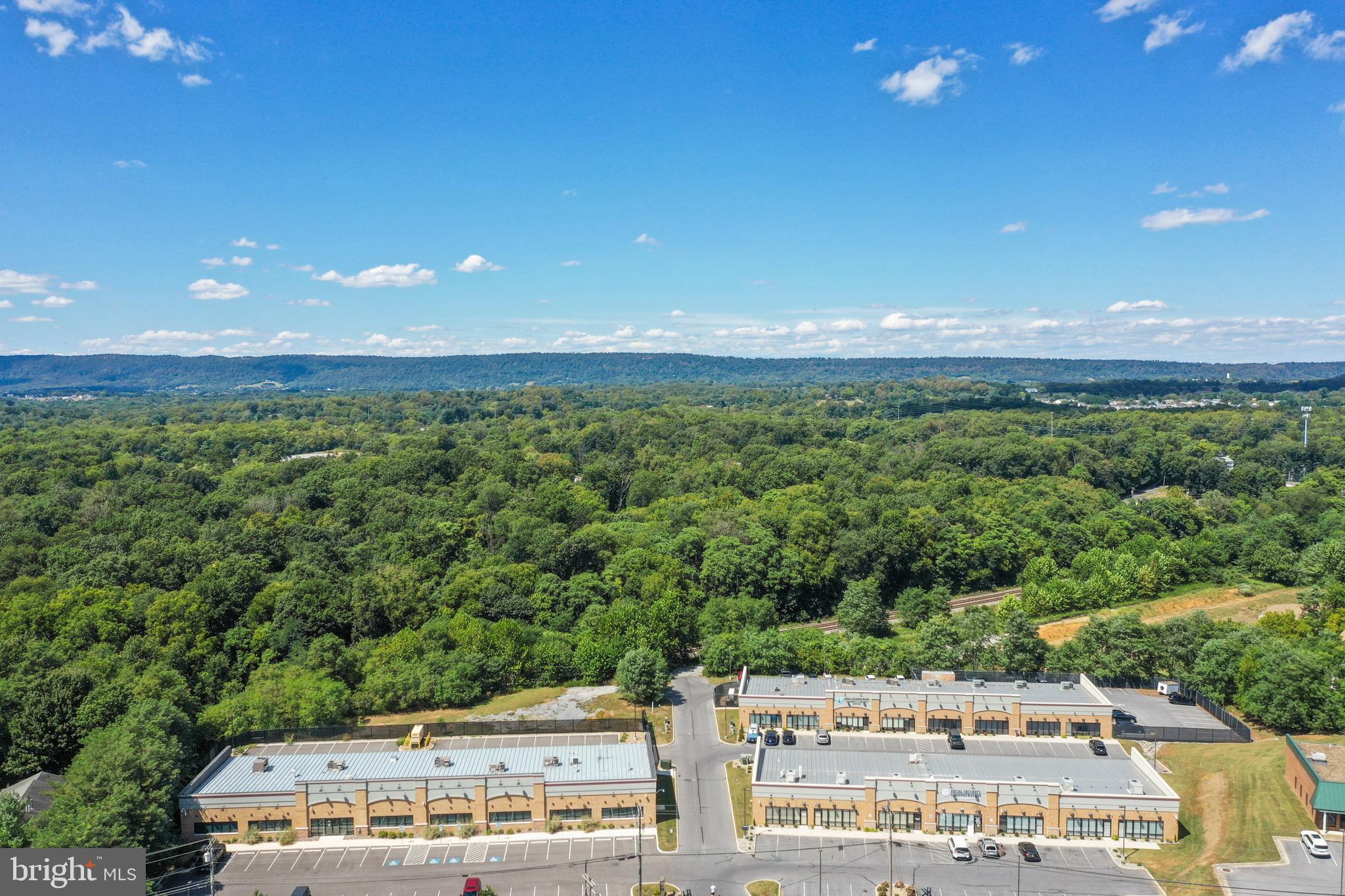 Compass Pointe is a three-building office portfolio located at 13, 14, 15, 20, 30, and 40 Compass Pointe in Martinsburg, WV. The property totals 34,500 (+/-) square feet of single-story office space across three buildings on 8.55 (+/-) acres. Income is anchored by long-term GSA leases to essential federal agencies including the SSA, ATF, USDA, and U.S. Marshals, providing stable, credit-backed cash flow, with approximately 4,155 (+/-) square feet available for owner-occupant or lease-up flexibility and additional land ready for future expansion.

Ideally positioned just off I-81 at Exit 16E, the site offers excellent visibility, strong traffic counts exceeding 53,281 vehicles per day (Esri and Kalibrate Technologies, 2025), and immediate access to regional amenities. The property benefits from Berkeley County’s growing federal presence and its strategic location within the broader Washington, DC–oriented corridor.