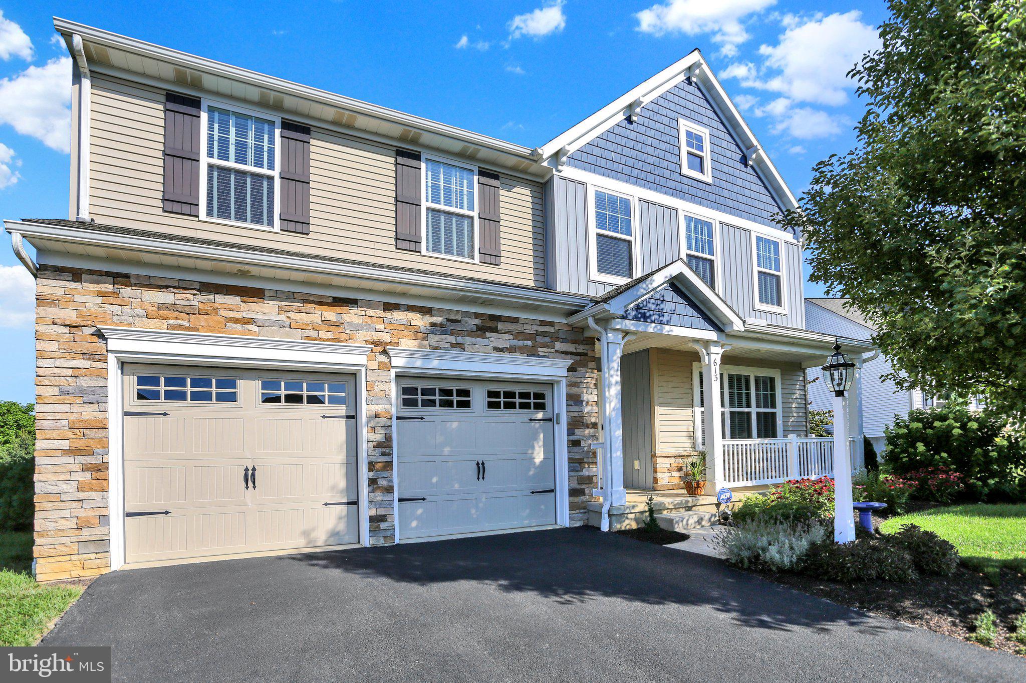 Nestled in the prestigious community of The Meadows at Bachman Run, this exquisite 5-bedroom, 3-bathroom residence embodies luxury and sophistication. Built in 2016, the home showcases a traditional architectural style, enhanced by a stunning blend of shake siding, stone accents, and vinyl finishes that create a timeless exterior. Step inside to discover an expansive 3,042 sq. ft. of meticulously designed living space. The interior features a harmonious blend of engineered wood flooring and plush carpeting, complemented by crown moldings that add an elegant touch with 9 foot ceilings on the first floor.   The heart of the home is the gourmet kitchen, equipped with stainless steel appliances, quartz countertops, an island for culinary creativity, and a cozy breakfast area that invites casual dining. The formal dining room offers an exquisite setting for entertaining, while the combination kitchen/dining area fosters a warm, inviting atmosphere. Retreat to the luxurious primary suite, complete with a large walk-in closet and a spa-like bathroom featuring a soaking tub and a walk-in shower. Each additional bedroom is generously sized, providing ample space for relaxation and privacy.  All second floor bedrooms have walk-in closets.  The outdoor space is equally impressive, featuring extensive hardscaping that enhances the beauty of the lot. Enjoy serene moments on the covered deck or patio, surrounded by a sloping rear yard that offers a perfect backdrop for outdoor gatherings. The full basement with a superior wall foundation that walks out to the backyard is ready to be finished for additional living space.  Additional highlights include an attached garage with extra storage, upper-floor laundry, and energy-efficient insulated windows. This property is not just a home; it's a lifestyle of elegance and comfort, waiting for you to make it your own.