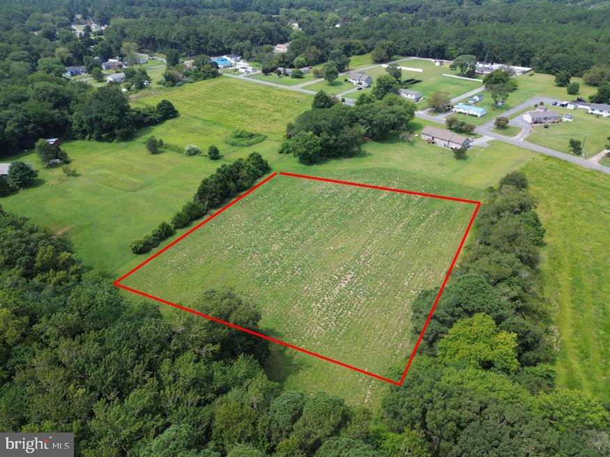 Raw flat lot. Perc tested and septic approved for a 4 bedroom residence. Located in sought after Berlin, MD -- A charming historic town, just about 8 to 10 miles inland from the Atlantic Ocean beaches of Ocean City and Assateague Island. Short drive (around 15-20 minutes) to the sand and surf. It's a popular, quieter alternative to the busy boardwalk, offering a relaxed vibe while still being very accessible to the beach.  

Owner reserves the right to approve location of future driveway on the lot.