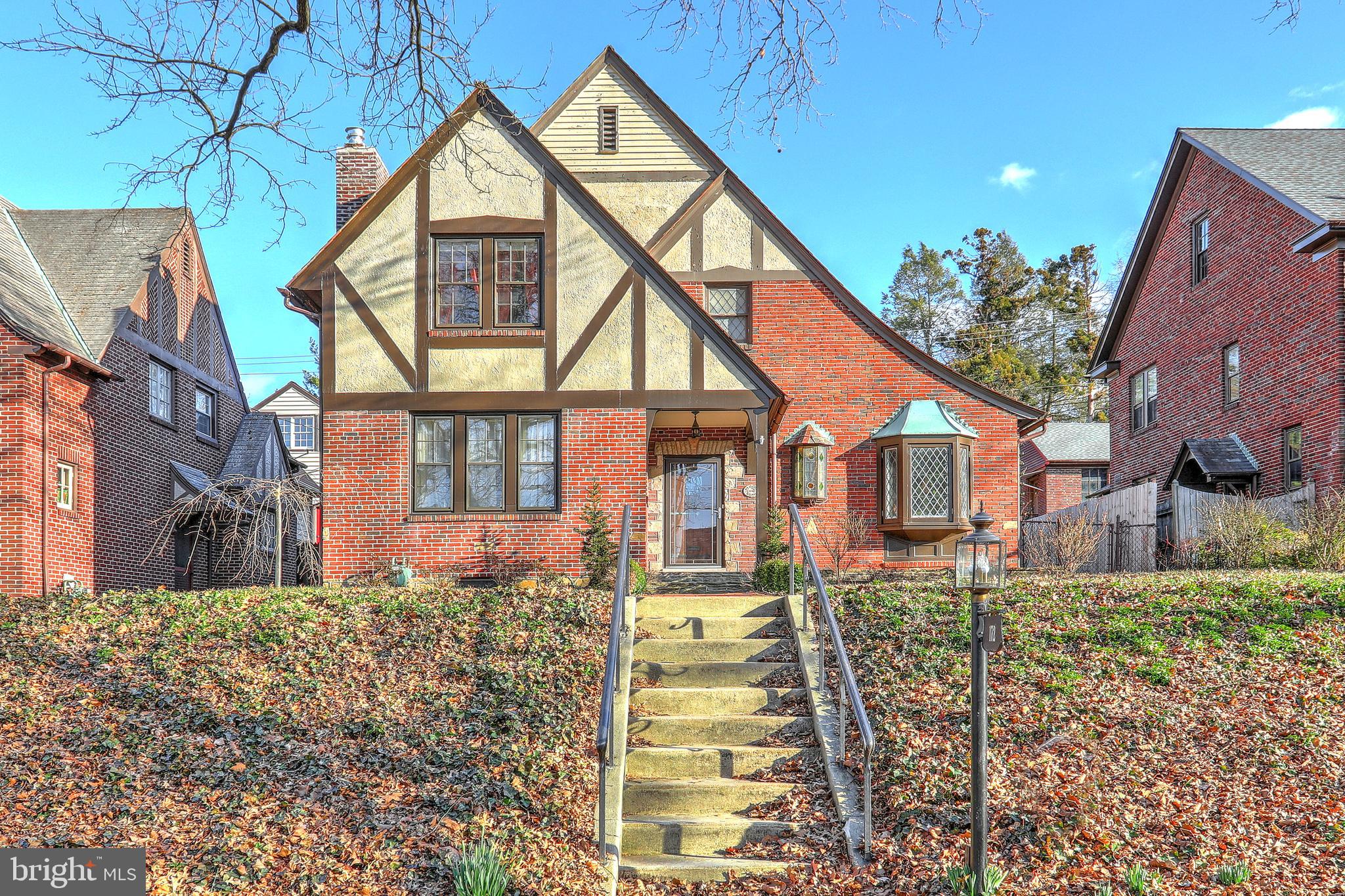 Spectacular Tudor in the heart of Historic Springdale!  With-in walking distance of York Hospital and minutes from York College and I-83.  Old World Charm throughout!  Accent moldings,  arched doorways ,  paneled doors,  coffered ceilings,  beveled and stain-glass windows.  Completely remodeled Kitchen with stainless steel appliances,  granite counters with tile backsplash and a tile floor flows to a large Family Room addition.  Family room features vaulted ceilings,  Gas Fireplace and a Wet Bar with wine cooler.  The laundry is located in the lower level along with a worker/staff toilet.  A brick patio off of the Family Room leads to a beautiful fenced out-door space with a fish pond.  A two car garage rounds out the private back yard space.