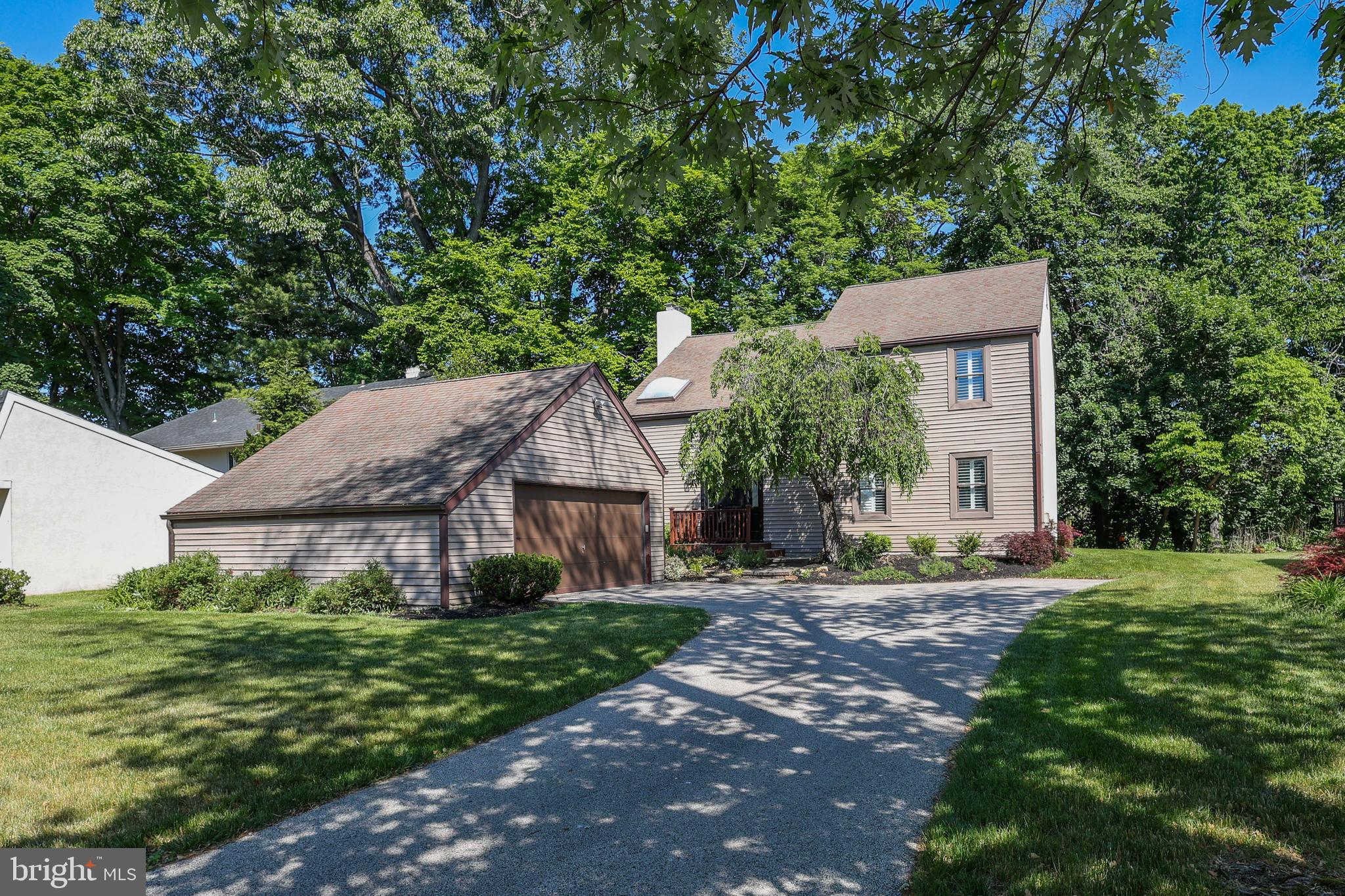 This is more than a home, it’s a lifestyle. Don’t miss your chance to own a piece of one of Bryn Mawr’s most desirable neighborhoods! Tucked into a quiet cul-de-sac within Ithan Mills, one of Bryn Mawr's most established and community driven neighborhoods, 206 Drakes Drum Drive offers 3372 square feet of living space in the kind of setting that rarely becomes available. This well maintained 4 bedroom, 3.5 bath, contemporary is move-in ready, and the lifestyle it delivers goes well beyond the walls of the home. From the moment you enter the welcoming foyer, the home offers a seamless flow highlighted by gleaming hardwood floors throughout. The formal living and dining rooms are connected by natural light and open sightlines, an effortless arrangement for entertaining. The timeless designer kitchen flaunts granite countertops, artisan handmade backsplash tiles, and a full suite of stainless-steel appliances including a Whirlpool refrigerator, Bosch stove, microwave and dishwasher. A stylish built-in coffee bar adds charm and convenience, complete with floating shelves, storage and a wine cooler. The sun-drenched breakfast area makes mornings feel easy. Adjacent, the family room centers around a statement brick fireplace and opens directly to an expansive deck overlooking a private, tree-lined backdrop. A powder room and laundry room complete the main level. The main level has been freshly painted in premium Benjamin Moore color. The fully finished lower level has been refreshed top to bottom including new flooring, updated walls, and a full bathroom, making it equally suited as a home gym, media, playroom, or additional living space. The brand new high efficiency natural gas furnace adds peace of mind. Upstairs, a spacious hallway gives the second floor an open, unhurried feel. The primary suite offers two closets, wall mounted cabinets and a lavishly updated en suite bath with a skylight, frameless glass shower and a soaking tub. Three additional bedrooms, each with ample closet space, share a hall bath with an oversized vanity and glass-door shower. A detached two-car garage rounds out the property. The Ithan Mills neighborhood connects directly on foot to Ithan Elementary School, with walking trails leading to playing fields, playgrounds, and tennis and basketball courts. SEPTA regional rail is minutes away for an easy Center City commute, with quick access to major routes including Routes 30 and 476. This is Main Line living at its most livable, a meticulously cared for home in a neighborhood with real roots.
