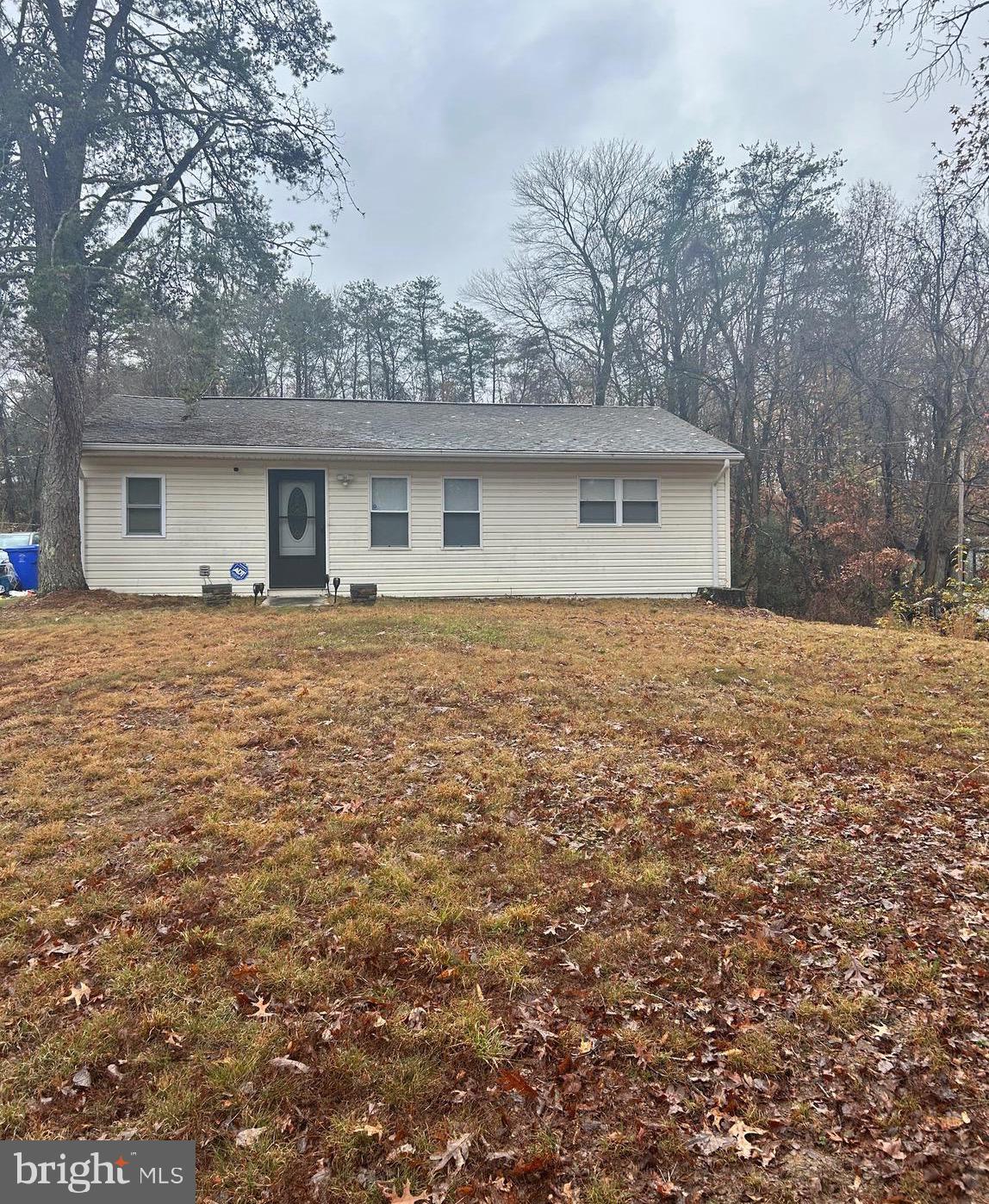***** Back on the Market Buyers financing fell through. Explore this charming ranch style home featuring two bedrooms and one bath, set on a 0.71-acre lot.  Gutter guards, Stainless steel appliances and ceramic tile floor. Side door entry with dining area off kitchen and separate laundry and utility room. Hardwood floors in living area. Huge 15' x 25' workshop with electricity. Septic system replaced 2019.  New carpet.  Seller’s Preferred Title Company Lakeside Title