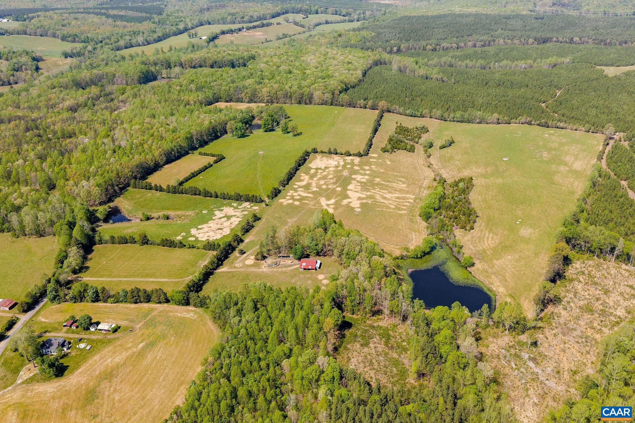 Cedar Plains Farm - 95 acres of rolling Goochland County countryside offering a compelling mix of open meadow, hardwood forest, and multiple ponds. The land carries genuine agricultural potential, with cleared acreage suited to pasture, crops, or equestrian use, and wooded sections providing privacy, mature hardwood timber, and natural cover for abundant wildlife. The varied topography offers several strong building sites for a primary residence or estate compound, with long views across the meadows and natural screening from neighboring properties. Zoned A-1 with frontage on Cedar Plains Road, an existing well, and four water troughs already in place, the property is immediately functional for agricultural use. A versatile rural holding in a part of the county known for its scenic character and quiet remove from Richmond.,Cedar Plains Farm
