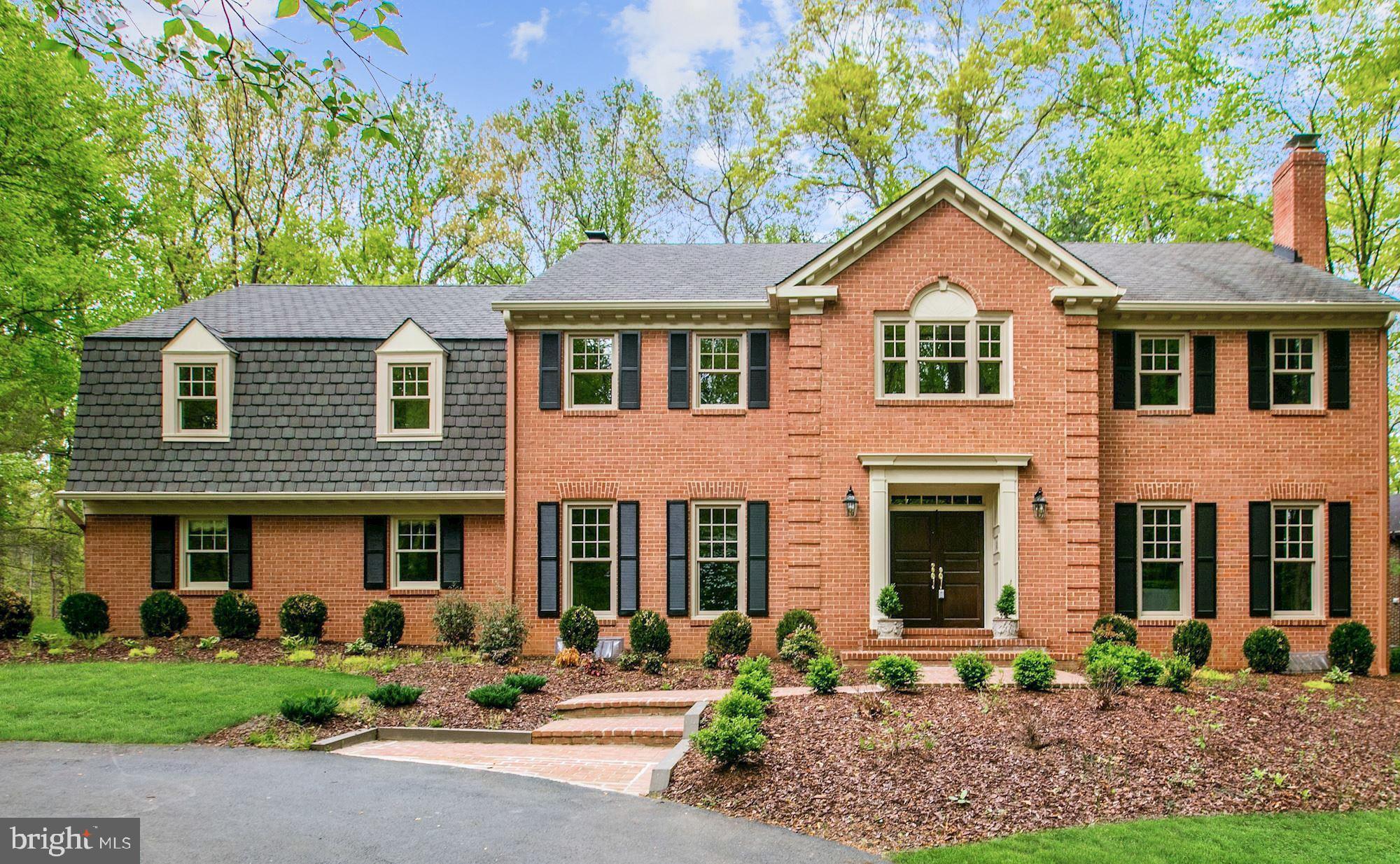 OWNERS HAVE A SIGNED LEASE  - HOUSE HAS BEEN RENTED UNTIL 12/31/22
7624 Georgetown Pike is a gracious and welcoming brick Colonial on 1 acre in Tollbrook Ridge.; a quiet  exclusive  neighborhood off  of  Georgetown Pike.  Backing to tranquil parkland and situated at the end of a quiet cul-de-sac, this elegant residence spans approximately 6,100 finished square feet and offers 5 Bedrooms, a Guest Room, and 4.5 Baths. A discreet side-loading 2-Car Garage and Circular Driveway add to the beauty of this well-appointed property. The incredible living spaces extend outdoors onto the substantial two-tier Deck with built-in benches that overlooks the sweeping grounds. Surrounded by mature trees and finished with lush landscaping, this beautifully presented home showcases privacy while still being close to commuter routes, Tysons Corner, Downtown McLean, and Great Falls.   A coveted southwestern exposure floods the home with natural light, accenting the gleaming floors, custom millwork, high ceilings, and generously sized rooms. The Main Level begins with a wide and inviting Foyer that is highlighted by marble floors, a curved staircase, and lovely accent molding. The formal Living Room is warmed by a handsome wood-burning fireplace and flows into the Dining Room. Complete with stainless steel appliances, ample cabinet space, and an adjoining Breakfast Room, the Eat-in Kitchen also has access to the considerably large Deck.   The Family Room is graced with an eye-catching beamed ceiling, a wood-burning fireplace, and access to the Mud Room and Rear Deck. The Laundry Room/ Mud Room leads to the back Patio and connects to the 2-Car Garage. There is a second staircase from the Family Room that leads to the Upper Level. A private Library with a wall of built-ins is located off of the Foyer along with a Powder Room.  There are 5 Bedrooms and 3 Oversized Full Baths on the Upper Level, including a gorgeous Primary Suite that features an attached Sitting Room/Office, 2 walk-in closets, a Dressing Room with a vanity, and an En-Suite Bath. The 4 Secondary Bedrooms share 2 Hall Baths, each of which has two separate vanities.   The Lower Level is approximately 1,860 square feet of additional living space with a sizable Recreation Room, Dance Floor, and a Full Bar. Custom artificial windows highlight the Recreation Room and the custom-built bar includes a sink, mini-refrigerator, and cabinets/shelving for storage. A Guest Room, Full Bath, and Storage Room complete this level.