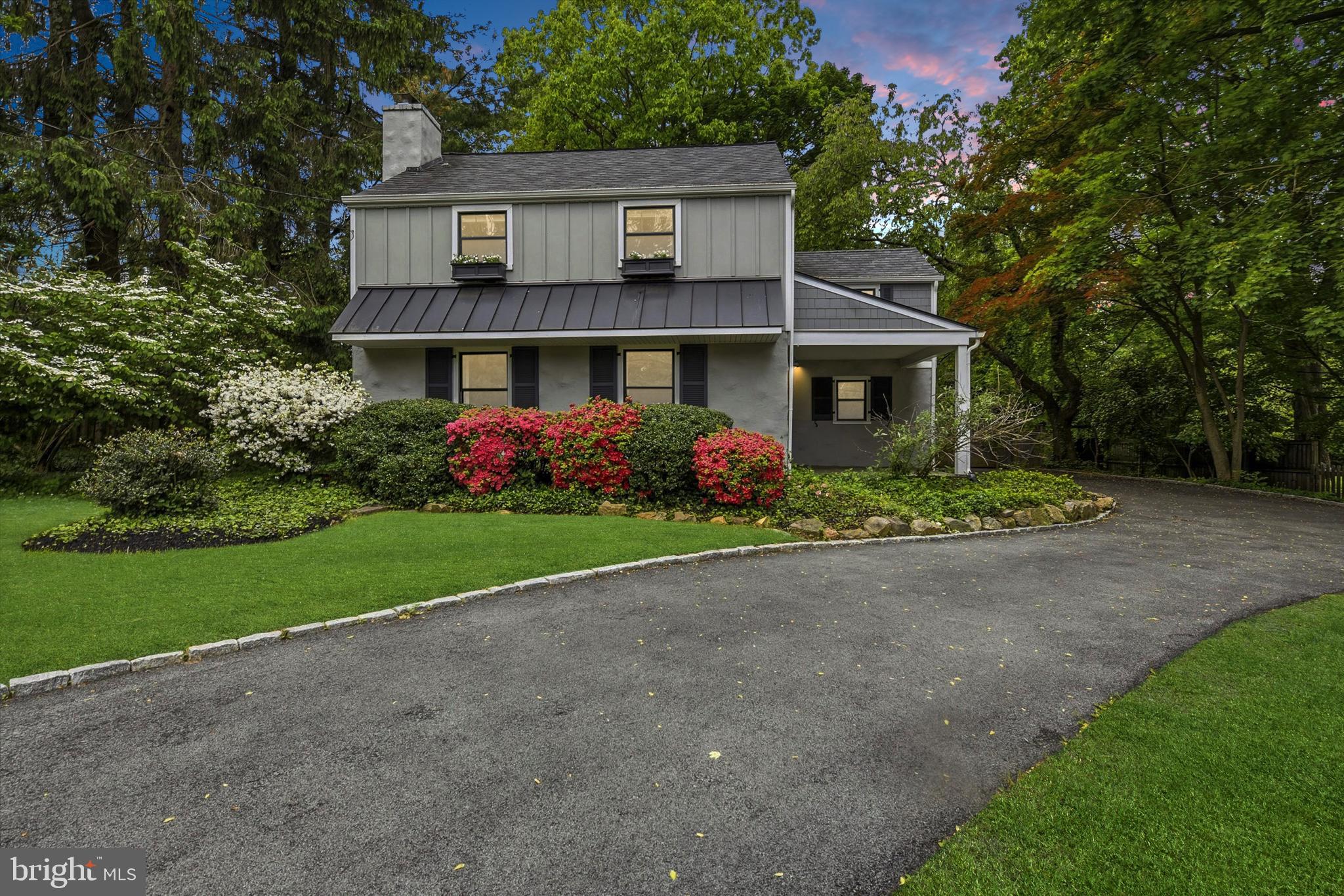 Welcome to this beautifully maintained and thoughtfully updated 3-bedroom, 2 full and 1 half bath home in the highly sought-after Tredyffrin-Easttown School District. Set back with a charming circle driveway, mature landscaping, and a covered front porch, this home offers wonderful curb appeal and an easy, welcoming entrance in every season.

The heart of the home is the stunning kitchen, where the ceilings have been opened and enhanced with skylights, exposed beams, and a vaulted shiplap-style ceiling that creates a bright and inviting gathering space. A large center island offers exceptional prep space and storage, with a built-in beverage refrigerator on one end and a microwave on the other. The kitchen also features abundant counter space, generous cabinetry, a coffee bar/wet bar area, and a sink overlooking the flat, fenced rear yard.

Just off the kitchen, the formal dining room features hardwood floors and provides a comfortable space for everyday meals or entertaining. The front room, originally the family room, includes a fireplace and built-in shelving, making it a flexible space that could serve as a formal living room, playroom, office, or second den.

The sunroom is truly a standout feature of this home, offering vaulted ceilings, skylights, built-ins, and charming brick flooring. Recently enhanced with a mini-split system, this room is comfortable and inviting while creating a wonderful connection to the outdoors.

The former garage has been converted into a spacious laundry room with access to the basement, adding function and convenience. A half bath completes the main level. (not included in the square footage)

Upstairs, you’ll find three bedrooms and two full baths, including a beautifully designed added bath with dual sinks. Each space reflects the care and updates this home has received over the years.

Outside, enjoy a flat, fenced rear yard with paver patio areas, perfect for relaxing, entertaining, play, pets, or gardening. The covered front porch is another charming spot to enjoy morning coffee or unwind at the end of the day.

The location is exceptional — minutes to Devon Prep, Terrain, Whole Foods, the Devon Horse Show, the Devon Train Station, and all that the Main Line has to offer. Additional updates include AC and furnace in 2018, along with replaced siding and a metal roof.

A warm, well-cared-for home in a premier Devon location — this one is truly special.
