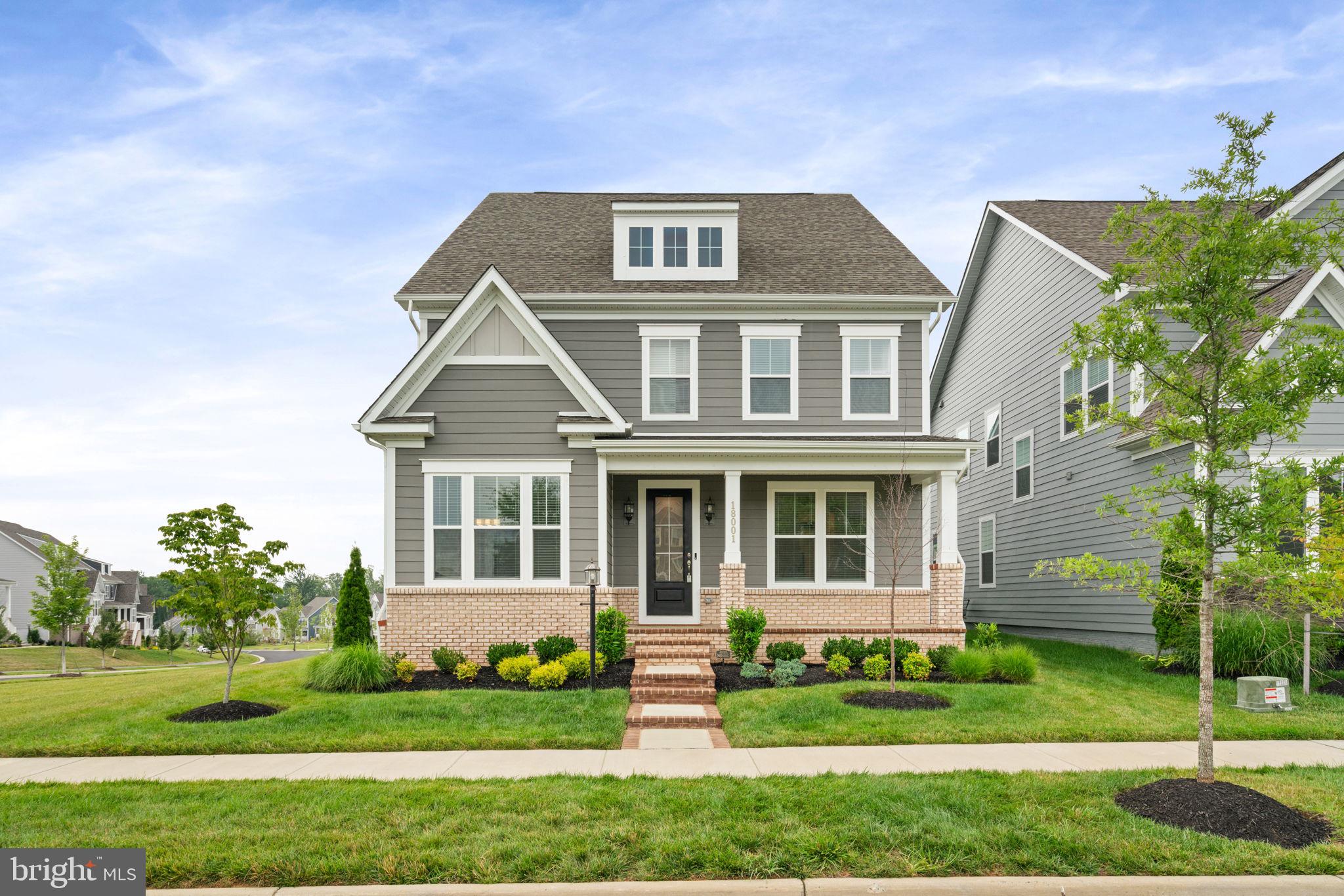 Welcome to this 24-month-old single-family home in the highly sought-after community of Potomac Shores in Dumfries, VA, Prince William County. This move-up home delivers over 4,600 square feet across three finished levels, with a covered deck and a rare rooftop garage terrace. If you are searching in  Northern Virginia for a nearly new home, you will find real value here. The open-concept main level is built for how people actually live today and includes a main-level bedroom and full bath, ideal for multigenerational living or guests. Several flex spaces throughout the home offer room for a home office, gym, or hobby space, a feature today's work-from-home buyers actively search for. The home has four bedrooms total, one on the main level and three upstairs, each with a walk-in closet. Parking is generous, with a two-car garage plus ample guest parking nearby, a detail move-up buyers consistently search for and rarely find. The home sits on a lot with open space on the sides and front, and it's within walking distance of the community playground and newest pool. Owner upgrades include a custom lower level with a bedroom and full bathroom, as well as a stackable washer and dryer. Thoughtfully curated design selections, custom blinds throughout, an in-ground sprinkler system, and custom lighting. There is nothing to do but turn the key on this home! Residents enjoy access to The Shores Club and Social Barns, including multiple pools, a state-of-the-art fitness center, a multi-purpose court, community gardens, playgrounds, miles of scenic walking trails, waterfront access, and a canoe launch along the Potomac River. If you're looking for more than just a home, but a lifestyle you'll love, Potomac Shores delivers. The community has an active social committee that hosts events year-round at the Social Barns and the event lawn. Potomac Shores Golf Club, designed by Jack Nicklaus, is open to the public and home to The Tidewater Grill, with sweeping views of the course and Northern Virginia sunsets. The community is home to neighborhood schools, and with a future town center expansion and a planned VRE stop on the horizon, Potomac Shores continues to position itself as one of Northern Virginia's most desirable communities.
If you're searching for a nearly new home in Prince William County, put this home on your list. Schedule your private showing today.
