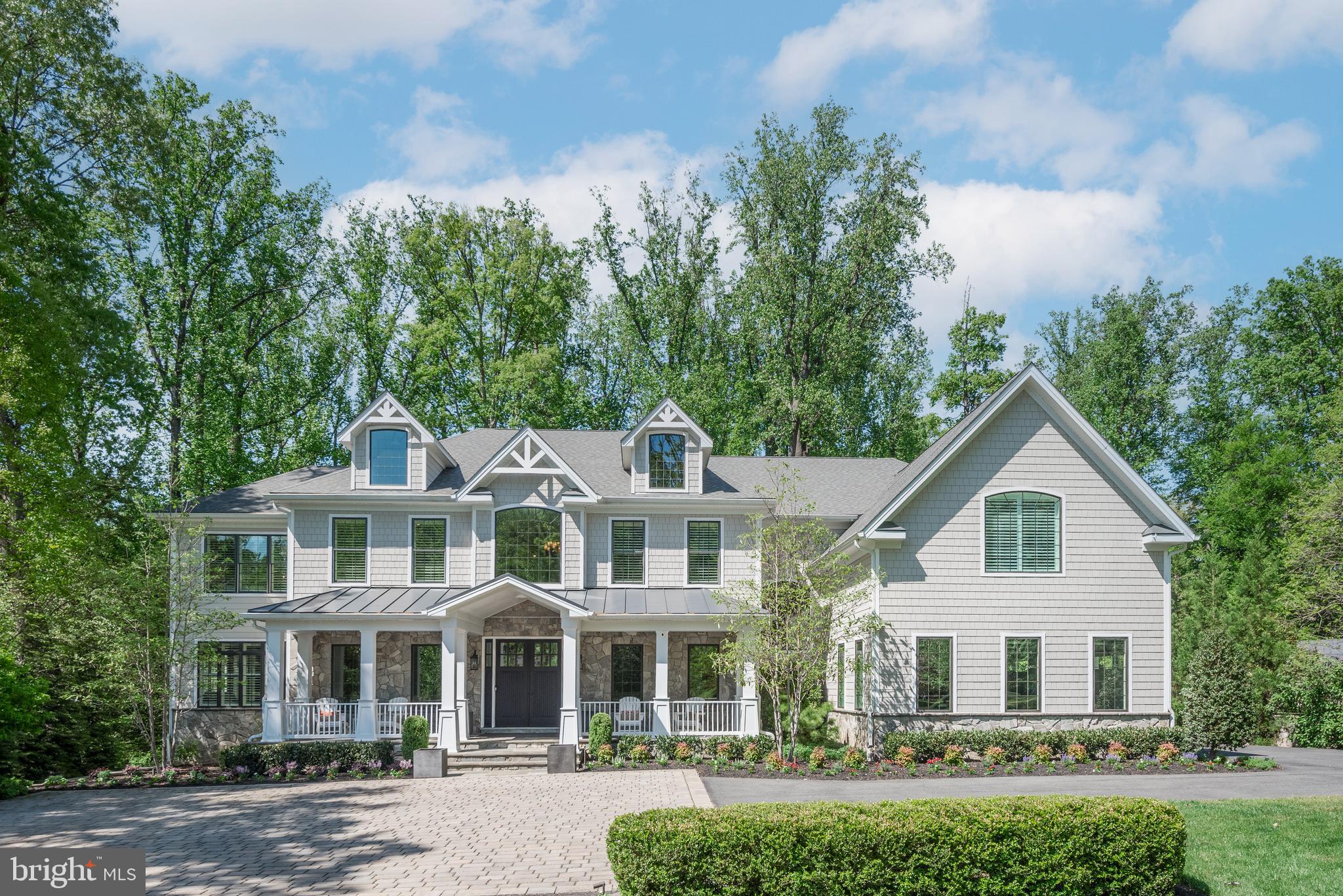 Exquisite 7-Bedroom Custom Estate — Over 12,000 Sq Ft of Luxury Living in the Churchill School Cluster — Minutes from Potomac Village

Step into this stunning, like-new custom home offering over 12,000 square feet of beautifully finished living space. Set on a private, wooded lot in the prestigious Churchill School Cluster, this 7-bedroom, 6 full bath, 2 half bath residence is a true masterpiece, featuring over $850,000 in upgrades and a layout designed for both everyday comfort and exceptional entertaining. Upon entry, you'll be welcomed by a formal dining room and formal living room, creating a grand atmosphere in the foyer, which features soaring ceilings, a dual staircase, and gleaming hardwood floors throughout. The main level also includes a light-filled home office, perfect for working from home, and a mudroom off the garage for added convenience and organization.
The chef’s kitchen is a culinary dream, featuring two dishwashers, an 8-burner stove, dual wall ovens, and a large quartz kitchen island that’s ideal for gathering. A walk-in pantry adds even more storage space, while Viking appliances and designer lighting further elevate the kitchen. The kitchen flows seamlessly into the grand family room and multiple entertaining spaces. Four upgraded HVAC systems ensure comfort across all levels. The upper level features bedrooms with en-suite bathrooms and abundant closet space, including the luxurious primary suite with a private sitting room perfect for relaxing, a built-in bar area, a custom walk-in closet, and a spa-inspired bath with dual vanities, a soaking tub, and a walk-in shower. An upper-level laundry room with custom cabinetry adds an extra layer of convenience.
The lower level is designed for entertainment with a recreation area, a game room, a custom bar, a $75,000 state-of-the-art home theater, a private home gym, and a walkout to a beautiful stone patio.
Outdoor living is equally impressive, with a spacious deck, built-in grill, irrigation system, custom hardscaping, a built-in fire pit, and spectacular landscaping — perfect for both hosting guests and enjoying peaceful moments.
Additional luxury features include plantation shutters throughout, LED lighting, and closet space galore.
Whether you’re sipping coffee on the front porch or relaxing by the fire pit, this home offers the perfect blend of luxury, comfort, and style. Located just minutes from Potomac Village’s shops, dining, and amenities, this exceptional property offers privacy, elegance, and a coveted location.

This is more than a home — it’s a lifestyle. Schedule your private tour today!