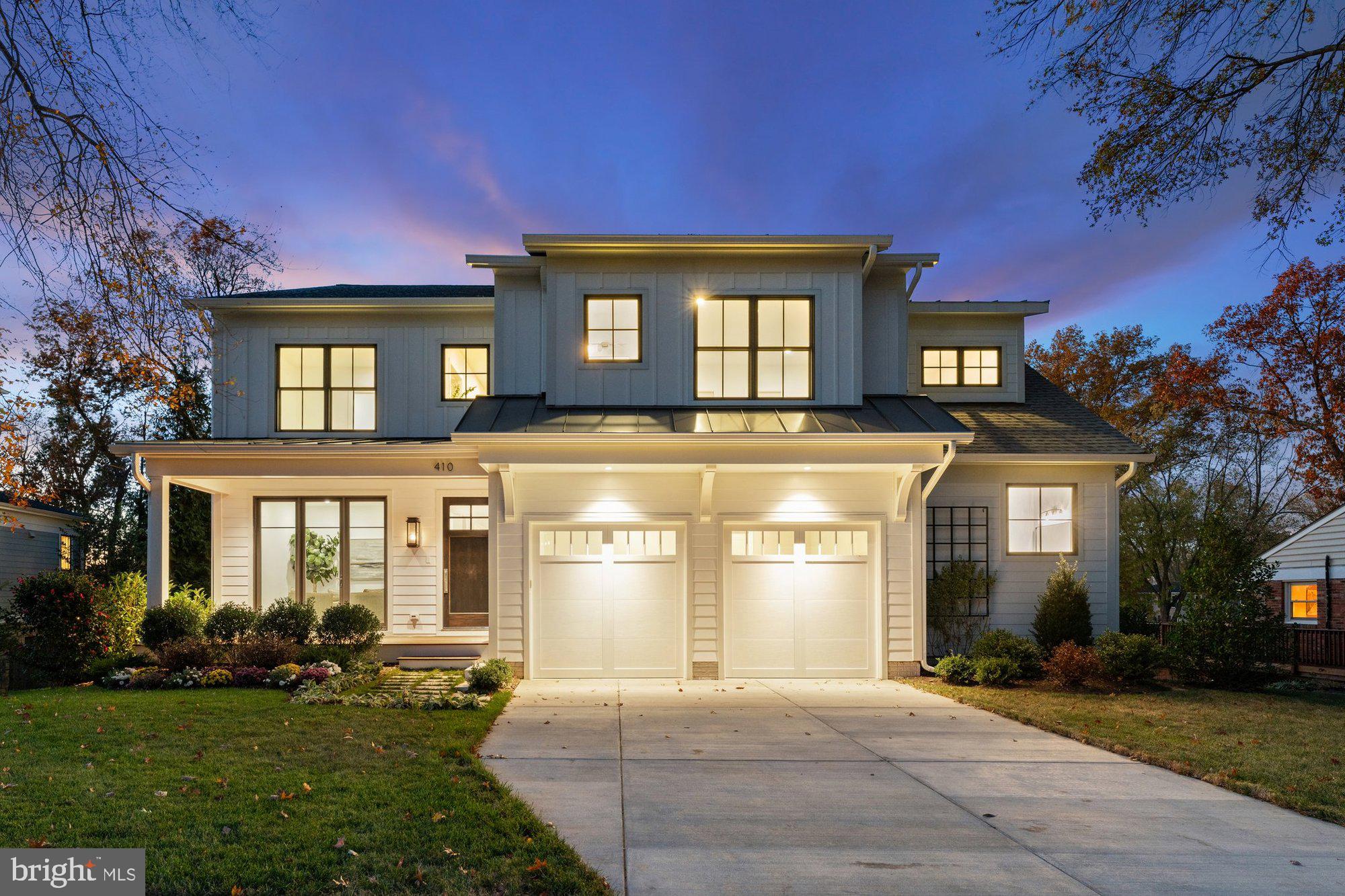 Stunning newly built custom home by Monarch Homes is conveniently located within walking distance to downtown Vienna. This impressive residence features 7 bedrooms, 6 full bathrooms, 2 half bathrooms, and a generous 6,634 finished square feet, all situated on a .30-acre lot. The high-end property showcases 9-foot ceilings on the main level, hardwood floors, and recessed lighting. Designed for entertaining, the open floor plan includes a living room, formal dining room, and a family room with a gas fireplace elegantly framed by modern oversized tile. The gourmet kitchen is a chef's delight, featuring a spacious island with bar seating, quartz countertops, and ultra-premium GE Monogram appliances, including a built-in refrigerator. Additional highlights include a stunning custom tiled backsplash, a six-burner gas range with griddle, built-in microwave, pantry, and a cozy breakfast room. Main level also includes in-law suite with en suite bathroom and private deck. On the upper level, you'll discover a luxurious owner's suite with  walk-in closet(s) area leading to a spa-like ensuite bathroom that boasts a large glass-enclosed shower, freestanding soaker tub, dual vanities, linen cabinets, and a separate water closet. This level also hosts four generously sized bedrooms, 3 bathrooms, and a convenient laundry room. Upper level also offers a flexible gathering space perfect for unwinding, reading, completing homework, or enjoying games. The finished walk-out lower level, featuring 10-foot ceilings and abundant windows, is filled with natural light and is an entertainer’s paradise. It includes two mounted television hookups flanking a linear gas fireplace, all set above a stylish custom wet bar with oversized tile surround. There is space that can be customized for a gym, home office, craft room, or au pair suite. Enjoy the charm of a covered front porch complete with a gas lantern, framed by mature imported evergreens that enhance privacy and a beautiful climbing trellis. The well-maintained backyard features extensive landscaping and a multi-level Trex Transcend deck, perfect for entertaining family and friends. The exterior also boasts a two-car front garage and a driveway with ample space for additional vehicles, ensuring convenience for homeowners and guests alike. Close to shops, restaurants, VA-7, and the Dulles Toll Road, this home is also within proximity to schools in the Wolf Trap, Kilmer, and Madison Pyramid.