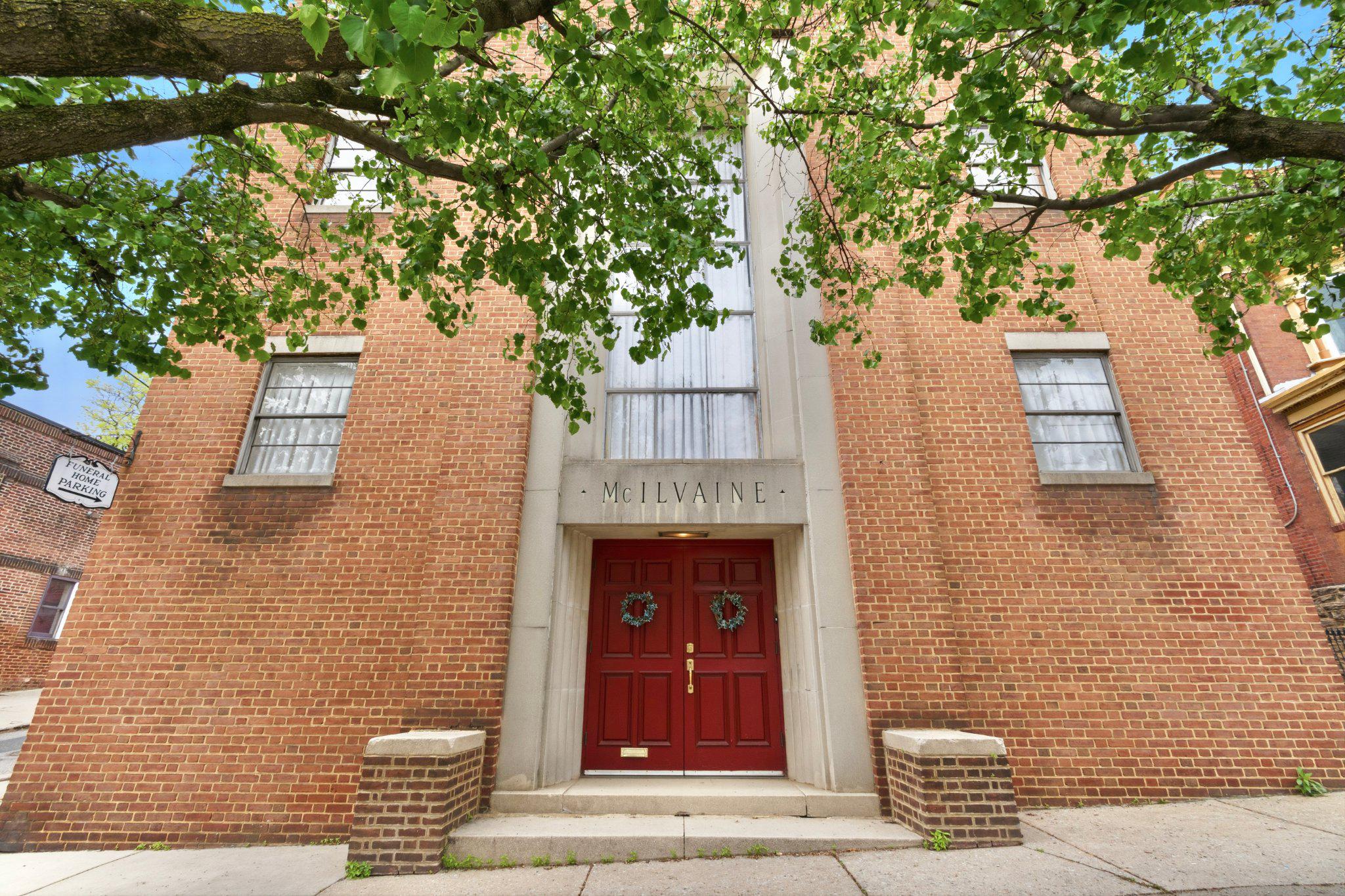 For the first time since 1950, a defining piece of East Falls is available for purchase, offering a rare opportunity to acquire the iconic cornerstone building at 3711 Midvale Avenue along with the parking lot at 3361 Frederick Street. This multigenerational, family-run landmark spans approximately 7,800 square feet across three levels, featuring a lower level consisting of the building’s mechanicals, several storage rooms, and access doors to the side street, while the main level is accessible from the main front stairs or the side driveway access ramp and includes a large open space with a gas fireplace, an office with a powder room, a rear sitting room with a powder room, a manual lift that lowers to the lower level, and a staircase that leads to the upper floor with access to the side street. The upper level offers a spacious open area with 15’+/- ceiling height and a front storage room, creating a versatile canvas within a property that benefits from a strategic dual-zoning advantage, the building is zoned CMX-2.5 while the parking lot is zoned RSA-5. This property is nestled among the neighborhood's popular restaurants and cafes and sits at the heart of a burgeoning culinary and social scene, benefiting from the established foot traffic of local favorites that draw residents from across the city.  Positioned just steps from the SEPTA Regional Rail and major bus routes. This is your chance to make a lasting mark in one of Philadelphia’s most resilient and flourishing communities. 3711 Midvale Ave and 3361 Frederick Street are separate parcels and have separate water/sewer and tax bills. Parking lot spaces are not marked, spot count is estimated.
