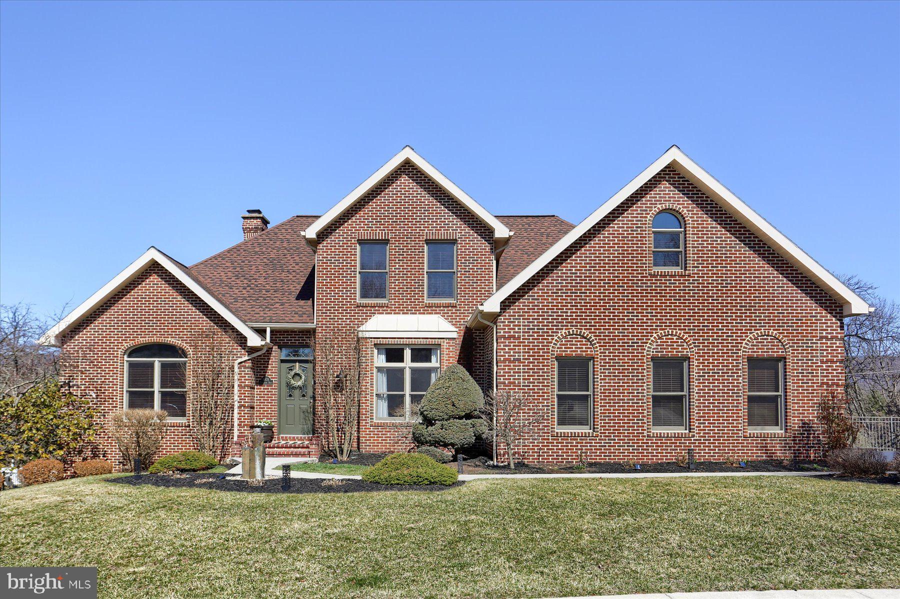Welcome to your dream home, a stunning traditional residence nestled in a serene suburban setting, offering a perfect blend of luxury and comfort. This meticulously maintained property boasts 2,406 square feet of elegant living space, featuring four spacious bedrooms and two and a half beautifully appointed bathrooms. Step inside to discover a warm and inviting interior adorned with crown moldings, recessed lighting, and plush carpeting. The gourmet kitchen is a chef's delight, complete with upgraded countertops, a large island, and energy-efficient stainless steel appliances, making it ideal for both casual meals and entertaining. The family room, conveniently located off the kitchen, invites cozy gatherings, while the formal dining room sets the stage for memorable dinner parties. Unwind in the luxurious master suite, featuring a walk-in closet and a spa-like bathroom with a jetted tub and walk-in shower.  The walk out basement offers additional open living space that is so cozy yet allows easy access to the backyard. 
 There is a workshop  as well as an enormous amount of storage available too. Outside, the property is equally impressive, with extensive hardscaping, lush landscaping, and inviting outdoor spaces, including a deck and patio perfect for al fresco dining. Enjoy breathtaking views of the golf course and mountains from your private oasis, complete with a hot tub for ultimate relaxation. With an attached oversized garage, electric vehicle charging station, and a prime location near amenities, this home is a rare find. Experience the perfect blend of luxury and comfort in this exceptional property—your new sanctuary awaits!