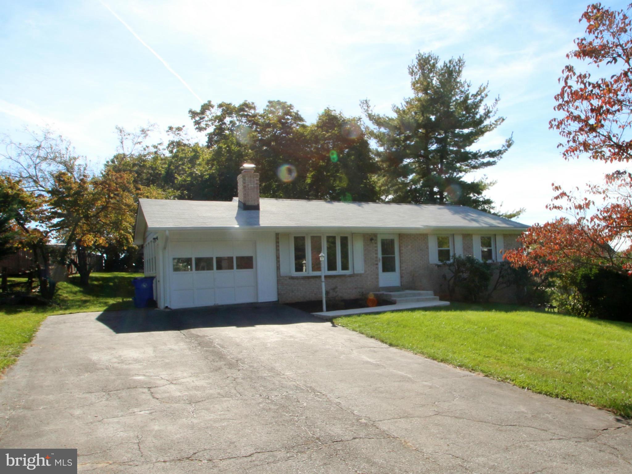 Updated Kitchen & Baths, New Roof, Gutters, Paint & Carpet, Refinished Hardwood Floors. Large Basement Family Room w/Wood Burning Stove, Shed w/Power, Wonderful Yard, Huge Driveway, 1 Car Garage, MUST SEE!