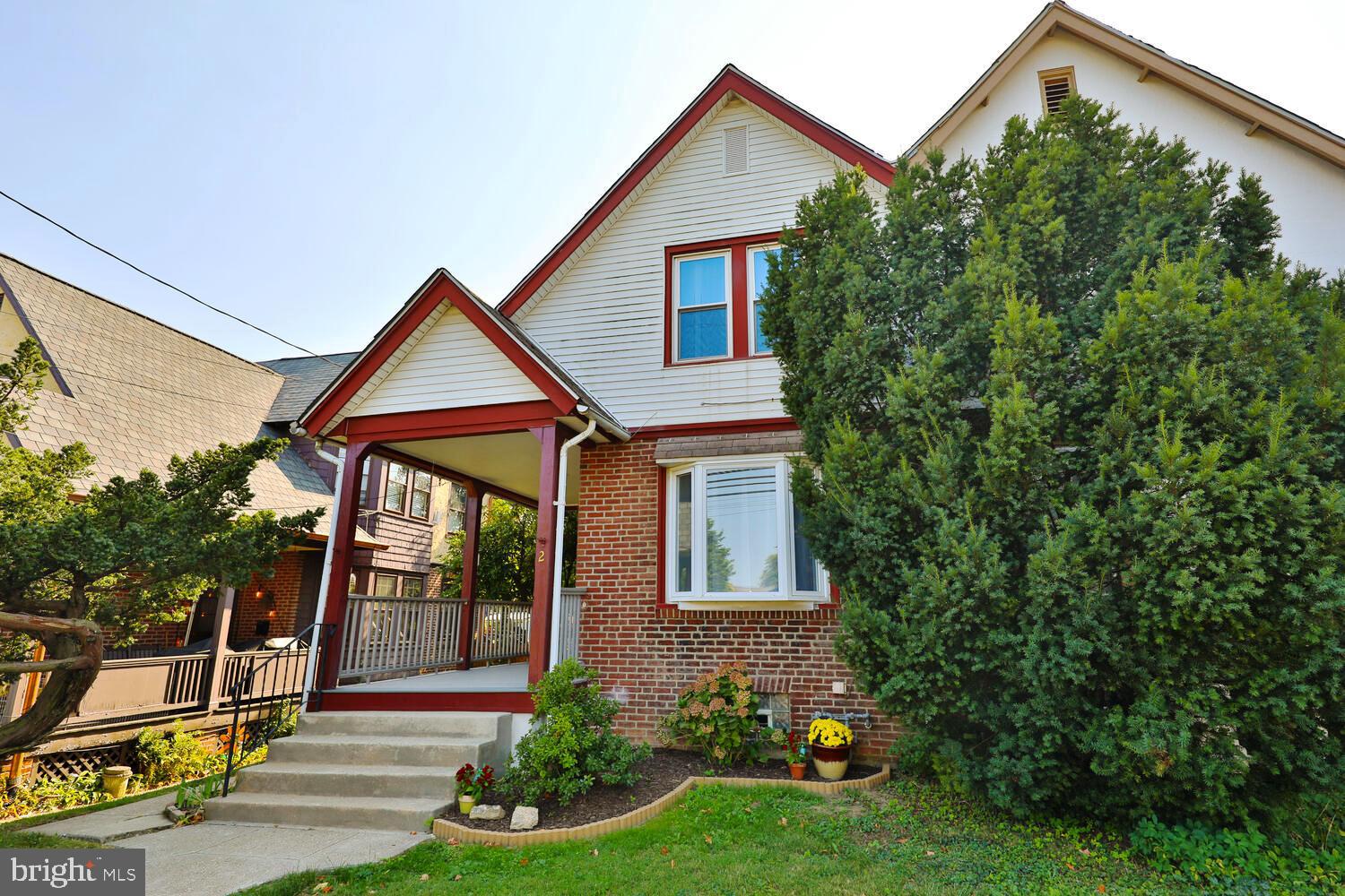 A welcoming front porch leads you to the front door of this charming Tudor style twin home.  Enter into the  front sitting room with it's bright picture windows and laminate flooring which continues into the large family room  graced by an additional  four window bay offering a wonderful sense of light and space .  Step into the eat-in kitchen featuring gas cooking and a flexible floor plan that includes the possibility for laundry hookup on this level if preferred.  The back door leads onto the back deck and into the fenced yard.   The second floor hosts three good sized bedrooms and a hall bath.  The basement is full and unfinished with washer/dryer hookups and  a utility sink.   The back deck is perfect for the Spring evenings as you sit under it's awning with a view of the back yard and gardens.  At the rear of this yard, steps away, are THREE PARKING SPACES easily accessed from a lane from Meetinghouse Road.  This lovely home is conveniently located between two train stations and a walk to the Old York Road corridor and Jenkintown offering great shopping, a movie theater, restaurants, Salus University and other fine schools close by.