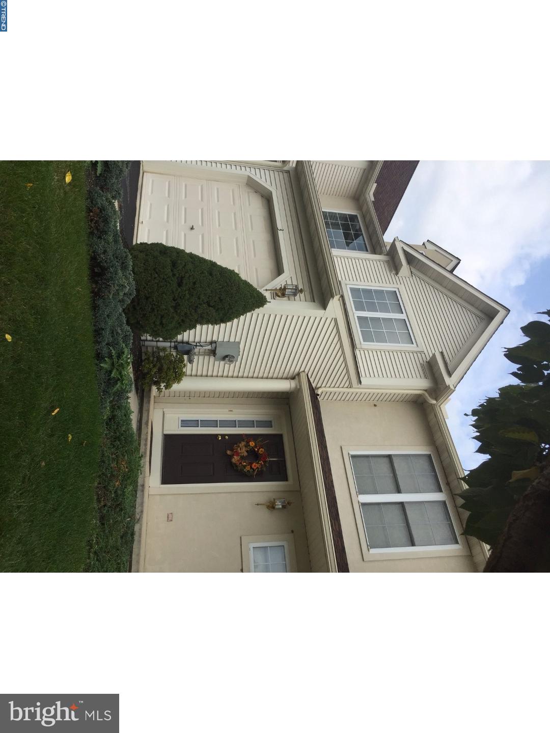 Don't miss this rarely available Deerfield Village townhouse nestled at the back of the subdivision near a lovely tree line. Step inside and fall in love with this immaculate space. Enjoy fresh paint in neutral tones, lush wall-to-wall carpeting, staggered kitchen cabinetry, a vaulted ceiling in the master bedroom, a cozy gas fireplace, and an unfinished lower level with full daylight (a perfect place to create more living areas).