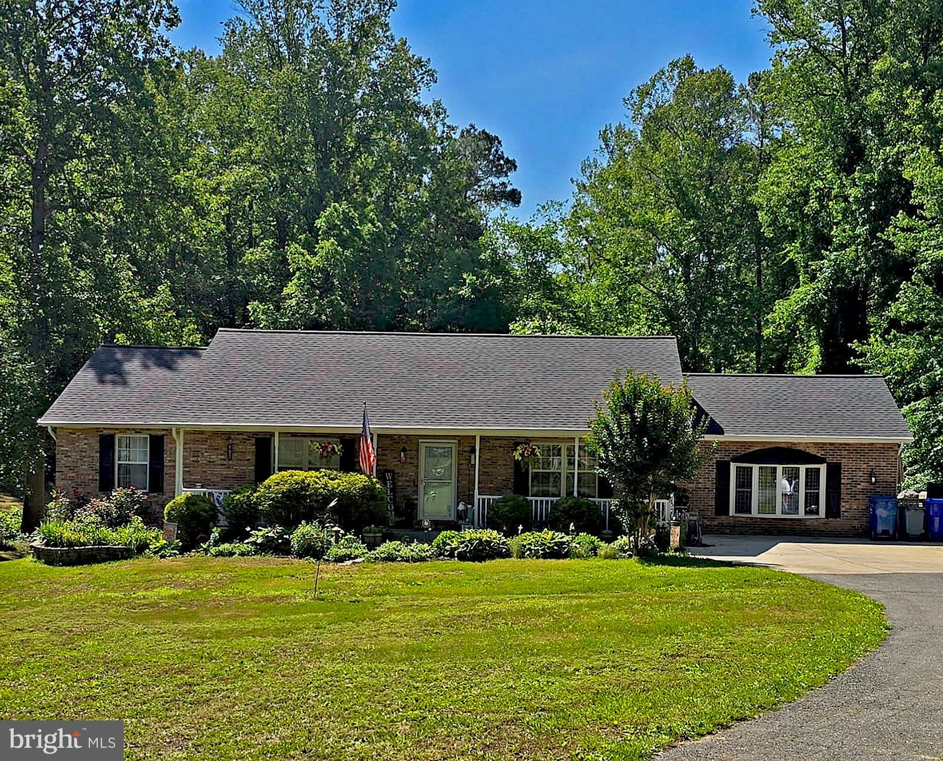 Escape to your own private country oasis on three pristine plus, fully usable acres. With no HOA this property offers ultimate freedom and privacy—perfect for bringing animals, building a workshop, or storing recreational vehicles. The flat, cleared land is surrounded by mature trees, featuring a welcoming front porch and a spacious side deck ideal for summer crab feasts.
Inside, the immaculate main level is completely move-in ready, boasting fresh paint, and an expansive family room built for entertaining. The fully finished basement adds incredible value and versatility, featuring an additional bedroom, full bath, and a second massive living area perfect for a multi-generational suite or recreation room. Tucked away just off Route 231, this private retreat offers the perfect blend of rural tranquility and an easy commute to both Washington DC and Pax River.