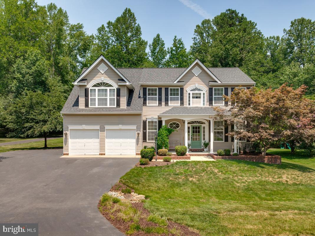 Welcome to 600 Marley Run, where timeless elegance meets resort-style living in one of Huntingtown's most sought-after communities. Perfectly situated on a beautifully landscaped lot, this exceptional 5-bedroom, 3.5-bath Colonial offers nearly 4,000 square feet of thoughtfully designed living space, combining everyday comfort with premium upgrades throughout.

Step inside to discover gleaming hardwood floors, extensive crown molding, a private main-level office with French doors, and an open-concept layout designed for both entertaining and everyday living. The gourmet kitchen features abundant cabinetry, granite countertops, stainless steel appliances, a spacious center island, and a large breakfast bar that flows seamlessly into the inviting family room with a cozy gas fireplace.

Upstairs, the spacious owner's suite offers a relaxing retreat with a luxurious ensuite bath and generous walk-in closet, while the additional bedrooms provide plenty of room for family and guests.

The finished lower level expands your living space with endless possibilities for recreation, fitness, media, or guest accommodations.

Step outside and experience your own private backyard oasis. Enjoy summer days in the heated and chilled in-ground pool, entertain on the expansive Trex deck, or unwind around the custom outdoor fireplace on the stamped concrete patio. Surrounded by mature trees, the backyard offers exceptional privacy and the perfect setting for gatherings year-round.

Meticulously maintained and ideally located just minutes from top-rated Huntingtown schools, shopping, dining, and commuter routes, this is a rare opportunity to own a truly move-in-ready home that offers the perfect blend of luxury, function, and outdoor living.