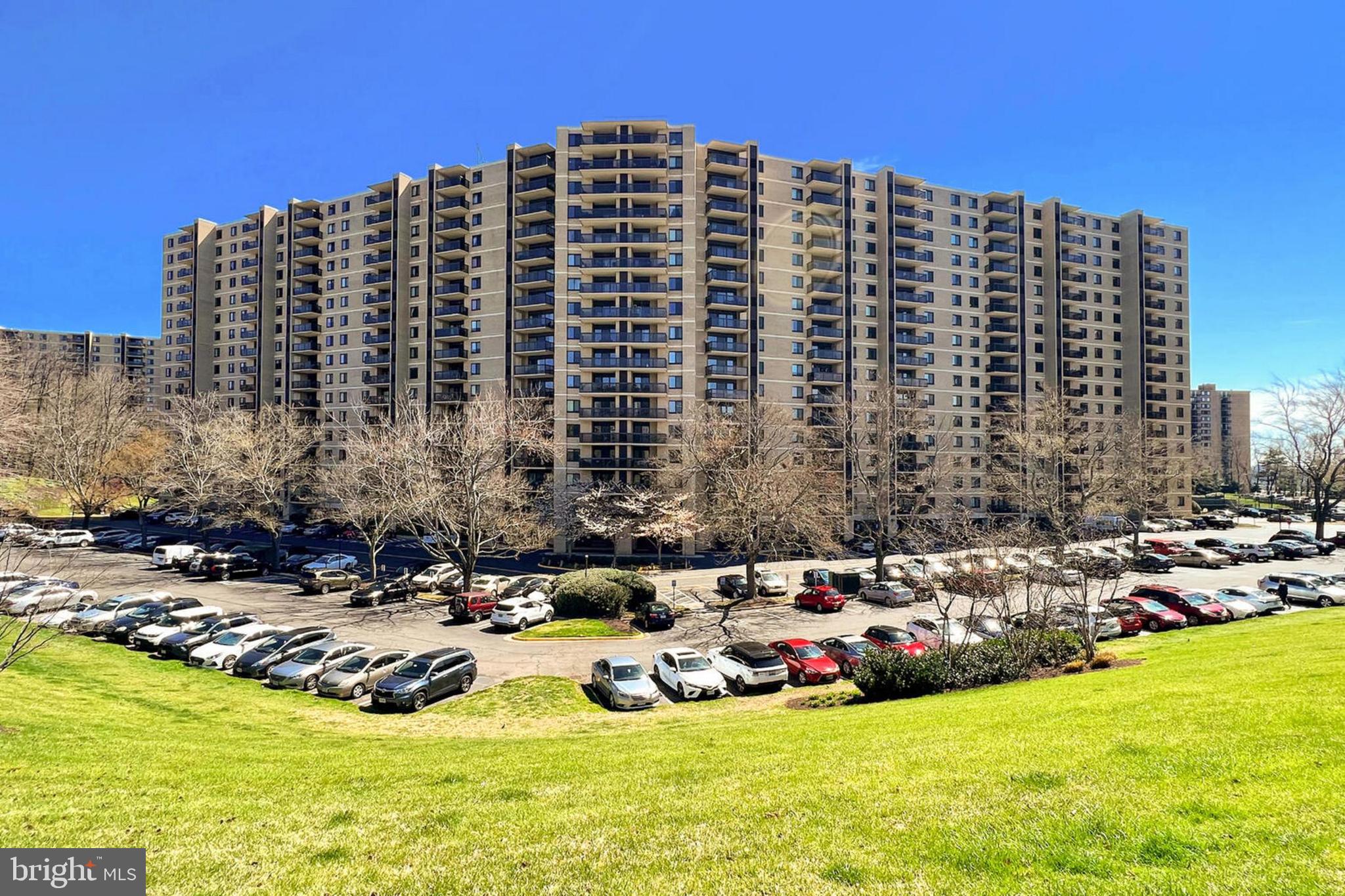 Welcome to Unit #703 at 205 Yoakum Parkway, Alexandria, VA! Step into luxury living with this stunning 2 bedroom, 2 bath high-rise condo in the sought-after Watergate at Landmark community in vibrant Alexandria. This beautiful residence offers the perfect blend of comfort and convenience, featuring solid brick construction, an open floor plan, gleaming hardwood floors, and an abundance of windows that fill the space with natural light. The updated kitchen and bathrooms showcase exceptional craftsmanship, while meticulous upkeep ensures this home is move-in ready and waiting for you to enjoy.

As you enter, rich hardwood floors lead you into the main living area, where the warm, neutral color palette enhances the spacious feel of the home. Floor-to-ceiling glass panels and a sliding door provide access to a private terrace, offering views of the resort-like pool and recreation areas, along with the skyline in the distance—perfect for both indoor and outdoor entertaining. The dining area is ideal for both formal and casual gatherings, seamlessly connecting to the gourmet kitchen, which features sleek granite countertops, custom cabinetry, and modern stainless steel appliances, including a glass cooktop range and built-in microwave. Stylish earth-toned tile flooring adds a touch of elegance, while a full-size, in-unit washer and dryer adds convenience to your daily routine.

Hardwood floors continue into the spacious primary bedroom, which boasts a large picture window, a walk-in closet, and a luxurious en suite bath. The bathroom includes a separate vanity area, contemporary lighting, and a glass-enclosed shower, all enhanced by beautiful spa-toned tile. A second bright and airy bedroom offers its own private bath, making it perfect for guests or a home office, adaptable to suit your needs.

Set in an upscale, resort-style community, the amenities at Watergate at Landmark are second to none. Inside, you’ll find a chic lobby, a 24-hour concierge, an indoor pool and hot tub, a party room, a library, a game room, an indoor driving range, and a fully-equipped fitness center. Outdoors, multiple swimming pools, tennis courts, walking and jogging paths, and lush common grounds await. For ultimate convenience, an on-site convenience store means you’ll have everything you need right at your fingertips. The picture of style and ease, your new home awaits!  Comes with Parking Spot 305.