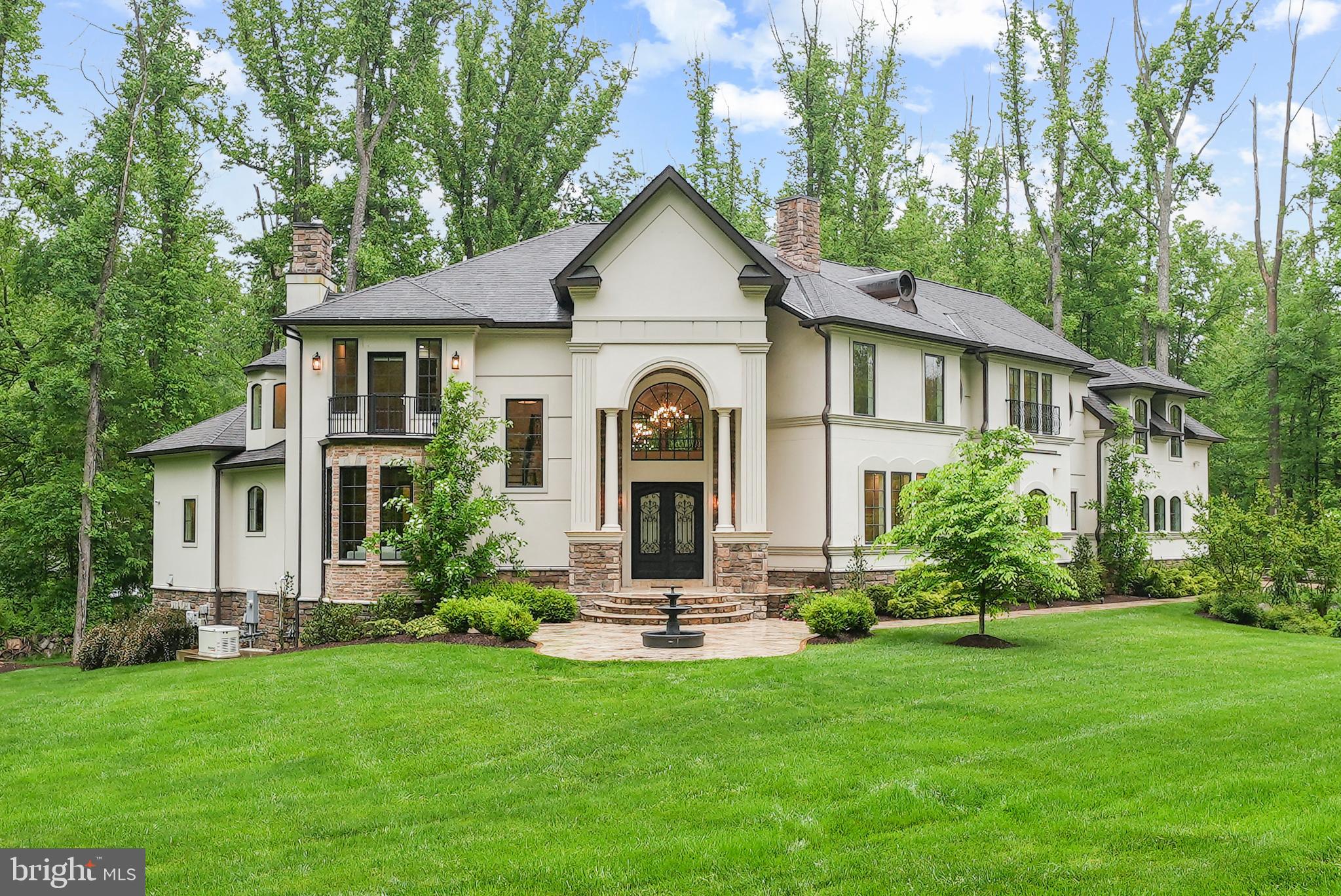 A desirable seclusion cradled by trees and only minutes from city life, 1060 Vista Drive is an exceptional offering that perfectly blends new-world modern conveniences with the prestige of old-world luxury. Situated prominently off a quiet, no-through street in the heart of McLean, Virginia, this opulent French-Mediterranean estate home commands wildlife & wooded views on its captivating 1.2 acre lot.

Elegantly proportioned and meticulously detailed on all three levels, this architectural masterpiece boasts nearly 10,000 square feet of beautifully appointed living spaces, enveloping you in sophistication and class. This estate exudes timeless elegance, integrating both indoor and outdoor living, featuring expansive living spaces adorned with custom finishes, rich textures, and high-end materials.

By combining elements such as wrought iron railings, multi-dimensional French Oak hardwood flooring, textured wall covering, and abstract glass & ceramic tiles, Vista is crisp, glamorous, and takes the indoor/outdoor living concept to a level appreciated by one of the NFL's best.

The living quarters invites spacious ensuite bedrooms with architectural surprises such as balconies, sundecks, sneakerhead-worthy closets, French doors, automated shades and AV elements.Explore it all by elevator. Arched glass floor-to-ceiling windows showcase the expansive level yard, perfect for adding a pool or enjoying a competitive Thanksgiving Day family football game.