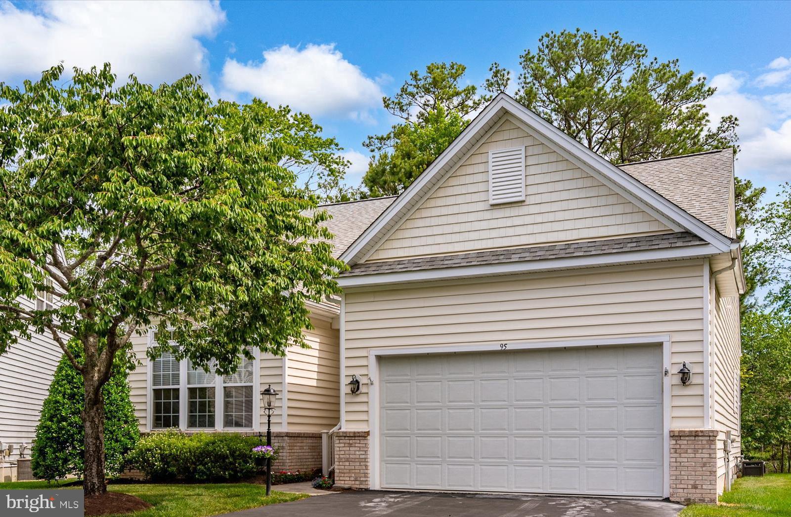 This highly sought after Osprey Model in the Parke at Ocean Pines' over 55 community is situated on a large culdesac wooded lot. It features a first floor primary bedroom with ensuite bathroom including double vanities, soaking tub and walk-in shower. The tray ceiling and and triple windows add to the ambiance of this desirable primary suite which also features a walk-in closet. The spacious foyer opens into a magnificent great room with gas fireplace. The wide open kitchen is equipped with a gas range with self cleaning oven, built-in microwave,  brand new dishwasher, and refrigerator with icemaker. A beautiful sunroom with 9 foot windows and a fireplace overlooks wooded yard and circular stone paver patio. There is also a 2nd bedroom with abundant windows, a den or 4th bedroom, another full bath and gleaming hardwood floors on the 1st floor. All of this level has 10 foot ceilings and soaring vaulted ceilings open to a loft above. The upstairs features a family room, a massive third bedroom and another full bath. The house has a two car garage with overhead storage. There is a fist floor laundry room with full size side by side washer and dryer. Can you imagine all of this in an active over 55 adult community with clubhouse, indoor pool, whirlpool, sauna, fitness center, card room. billiard room, library, huge wrap around patio overlooking lake with fountain and outstanding landscaping. In addition to all of these ammenities, The Parke HOA fee includes all grounds keeping and grass mowing and edging, mulching, shrub trimming, gutter cleaning, and  snow removal of driveways and walkways all for a low monthly fee of $245.00 per month. The Parke is located within a larger Home Owners Association of Ocean Pines. Ocean Pines features a marina with restaurant and clubhouse, multiple pools, tennis and pickleball courts, dog park, walking trails, 18 hole golf course, playgrounds, stocked fishing lakes, picnic areas and a beach club on the Ocean City beach . The HOA fee for Ocean Pines is $915.00 per year. Some amenities like swim clubs, golf and boat slips have additional reasonable fees for usage. Move in to The Parke at Ocean Pines and start living the dream just minutes to the Ocean City Beach.