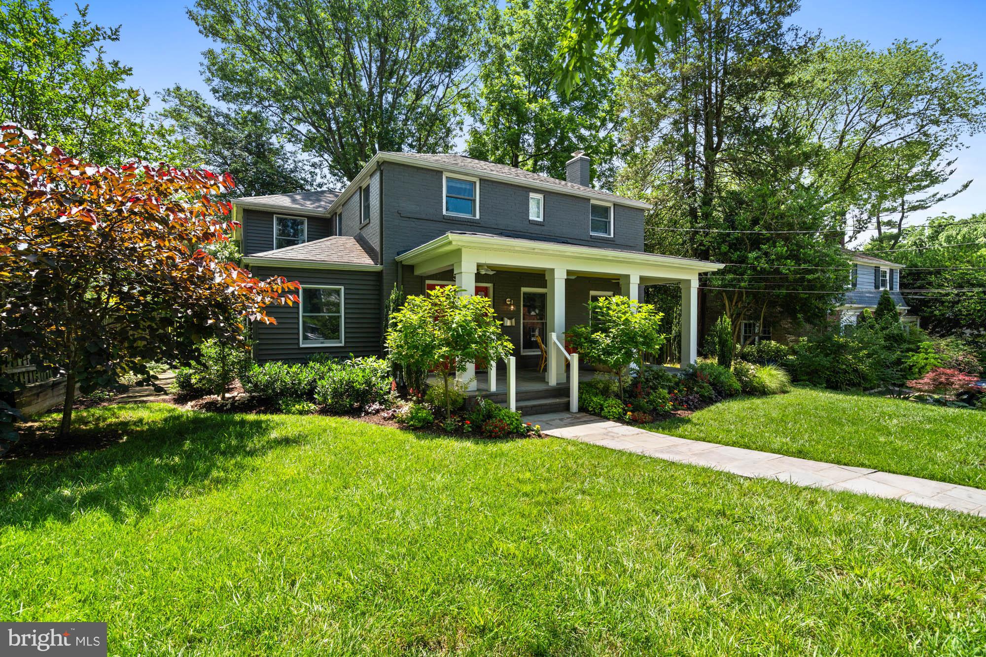 Artfully designed and expanded for today's lifestyles... welcome to 5313 Wakefield Road, Bethesda. This professionally updated home in the heart of Green Acres offers the best of indoor-outdoor living -- with whimsical touches, a welcoming front porch, and a garden that’s nothing short of resplendent.
If you have ever strolled down the street, you have likely noticed this home as it is a stand-out in design, color, and thoughtfulness. The wide front porch is approached by floral-lined pathways with a hint of knowing -- as if the home itself whispers, "Yes, I’m as enchanting as you think."

Inside, you’ll find a layout designed for modern and effortless life, beginning with an expanded kitchen at the heart of it all. With easy flow that allows for parties for 50 people as well as intimate dinners for six. Its welcoming foyer, and open sight lines create great flow and balance between the elegant, formal dining room, cozy living room, and bright and expansive great room. An extra large coat closet, powder room, and ample storage completes this level.

The great room is the hub of family life with a seating area surrounded by windows, gas fireplace with a stunning mantle, and built-in bookshelves; table space for casual entertaining and family meals; and a very functional, well equipped kitchen with large island, 36” cooktop, double oven, pantry, and loads of display and storage space (and extra refrigerator in the basement). Extensive counter space allows for group cooking or lets the chef hold court with friends arrayed on barstools around the island.

From here, French doors onto an expansive slate patio sized to accommodate a lounging area and room for a fire pit, a grill, table for eight, wood storage, a console table for serving or plants, and plenty of additional room.Parties for 25 guests easily accommodated, all under the charming cafe lights. Shaded by mature trees.

Every fixture and finish was selected with an eye towards the creation of a warm and elevated lifestyle - textures, colors, tile, fabrics, and natural materials create a harmonious home life.

Upstairs are four bedrooms, an extra large linen closet, and laundry in the hallway. The primary suite is generously sized and has lots of light from windows on three sides (four if you include bathroom windows). The primary bathroom is large and bright, with two separate vanities, and loads of storage. Three additional bedrooms, along with the renovated hall bathroom with separate bath and water closet that facilitates sharing.

The lower level is recently renovated with a large living space that includes a full bath and walk in closet, all designed to accommodate, playroom, extra family room, guest quarters, or work-from-home life.

The lot is enhanced with mature trees and flowering plantings that bloom in a riot of colors. The fenced back yard with patio provides privacy and a sense of retreat, perfect for catching fireflies or dining al fresco.

Updated and immaculately maintained, this 5313 Wakefield Road will have you hooked the moment you arrive.