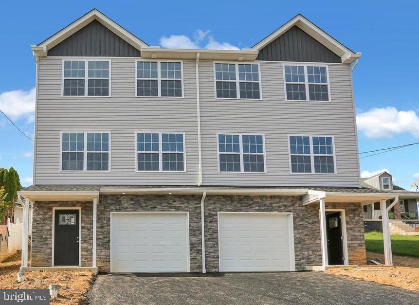 Beautiful New Construction Twin – Temple, PA

Welcome to this stunning new construction semi-detached home in Temple, PA, offering modern design, quality craftsmanship, and exceptional attention to detail. Currently under construction, buyers have the exciting opportunity to personalize select finishes, including interior paint colors, cabinetry, countertops, and flooring.

Boasting over 1,945 square feet of thoughtfully designed open-concept living space, this home features 3 bedrooms, 2.5 bathrooms, and a one-car garage.

The main living level showcases a bright and spacious layout with a breakfast area, dining area, kitchen, living room, and powder room. Sliding glass doors lead to the backyard—perfect for entertaining or relaxing outdoors. The stunning kitchen is appointed with stainless steel appliances, quartz countertops, white cabinetry, and luxury vinyl plank flooring throughout the entire level.

Upstairs, the primary suite offers a spacious bedroom, walk-in closet, and a private bath. Two additional generously sized bedrooms (one with its own walk-in closet), a full hall bathroom, and a conveniently located laundry room complete the upper level.

The unfinished lower level provides excellent potential for additional living space—ideal for a future family room, home office, gym, or recreation area.

Don’t miss your opportunity to own a customizable new construction home in a desirable Temple location. Scheduled for completion by June 30, 2026. Schedule your private tour today!