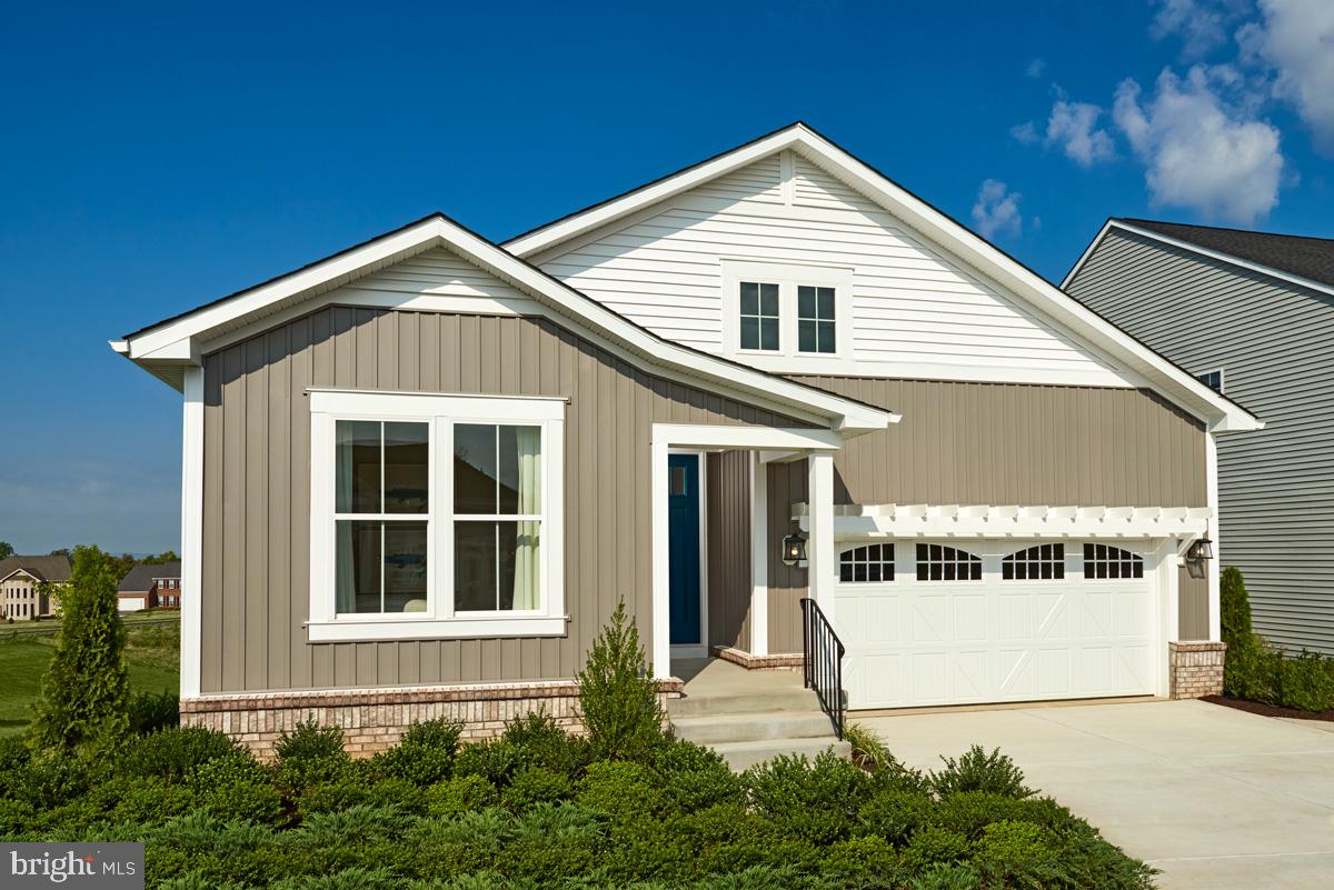 Welcome to the Arlington by Richmond American Homes! Greet your guests on the welcoming porch, then show them to their rooms and full bath upon entry! Meet them in your well-appointed gourmet kitchen with a center island, pantry, and stainless steel appliances, then relax in your great room with a fireplace, and end the night on your covered patio! A lavish primary suite is off the great room, showcasing vaulted ceilings, a deluxe bath with a walk in shower, and a generous walk-in closet! A convenient laundry room rounds out the main level. Head downstairs to the basement with a finished recreation room, bedroom, and full bath to host additional guests, with space to add an additional bedroom, and rough in plumbing for a wet bar, too!  Come see everything this home has to offer for yourself today!