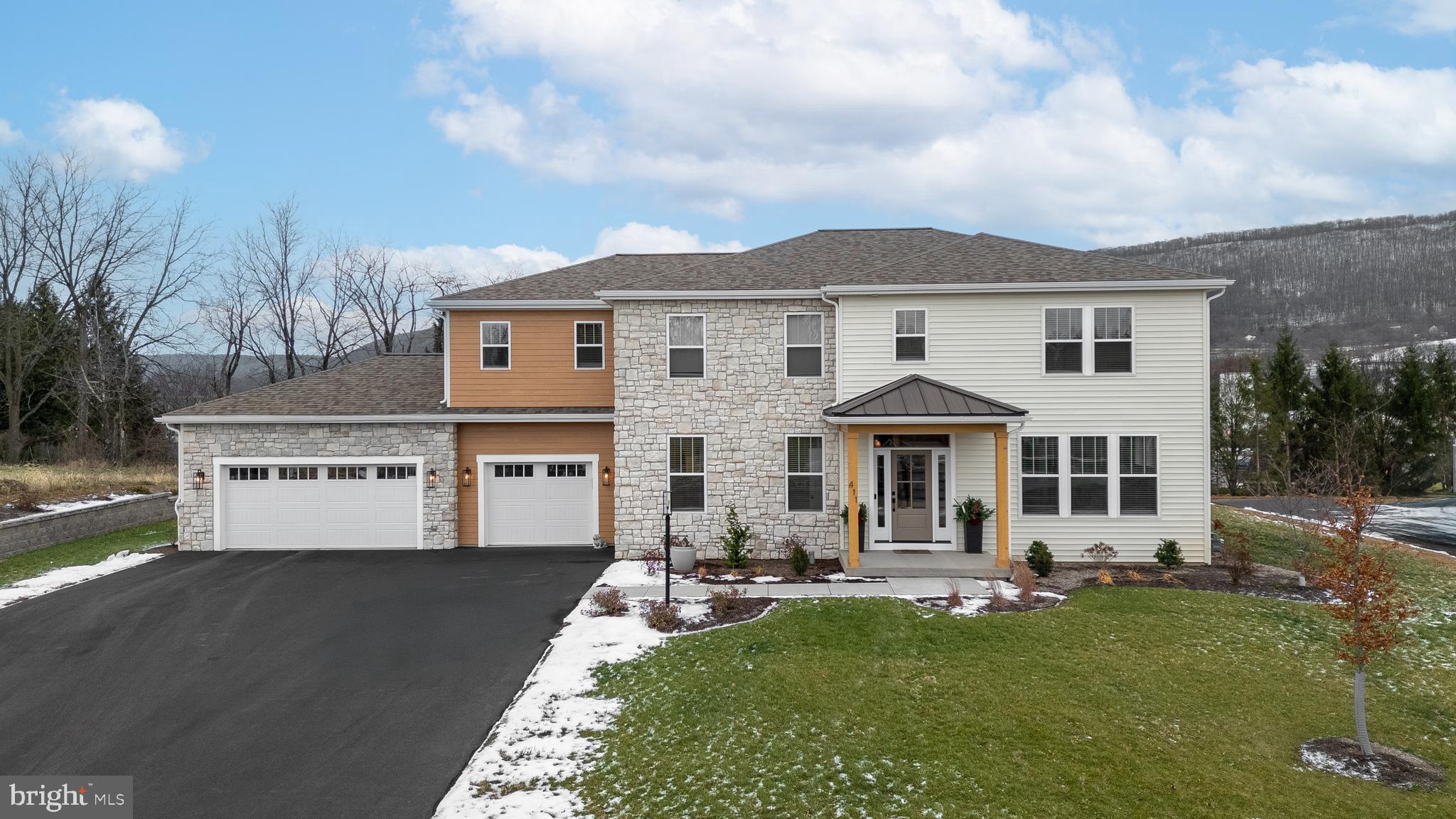 Situated in the highly desirable Winfield Heights neighborhood, this exceptional Hackman-built home is a blend of sophisticated design and modern luxury, offering 5 bedrooms and 4.5 baths, and beautifully finished by white oak flooring across all levels. The main level is thoughtfully designed for both entertaining and everyday living, featuring an expansive open-concept kitchen, dining, and living space filled with natural light, complemented by a versatile space that can serve as a formal dining room, office, or additional living room. The chef's kitchen boasts an oversized island with abundant seating and storage, complemented by a walk-in pantry with custom wood shelving, while the adjacent custom-built mudroom adds functionality and organization. Upstairs, the generous owner's suite includes plentiful closet space and a luxurious spa-inspired bath with radiant heated floors. An additional en-suite bedroom, two further bedrooms with walk-in-closets, a full bath, and a spacious loft area with endless possibilities, complete this level. A finished basement provides a fifth bedroom, full bathroom, and a flexible space for a home gym, playroom, office, or entertainment center, all while maintaining abundant dedicated storage space. Efficient with 3 zoned HVAC. Outdoors, the level backyard provides an ample covered entertaining space, rounding out this distinguished home. Ideally located close to Penn State and Beaver Stadium, this home is within walking or biking distance to the local elementary school, and offers easy access to nearby biking trails, combining luxury living with exceptional convenience.