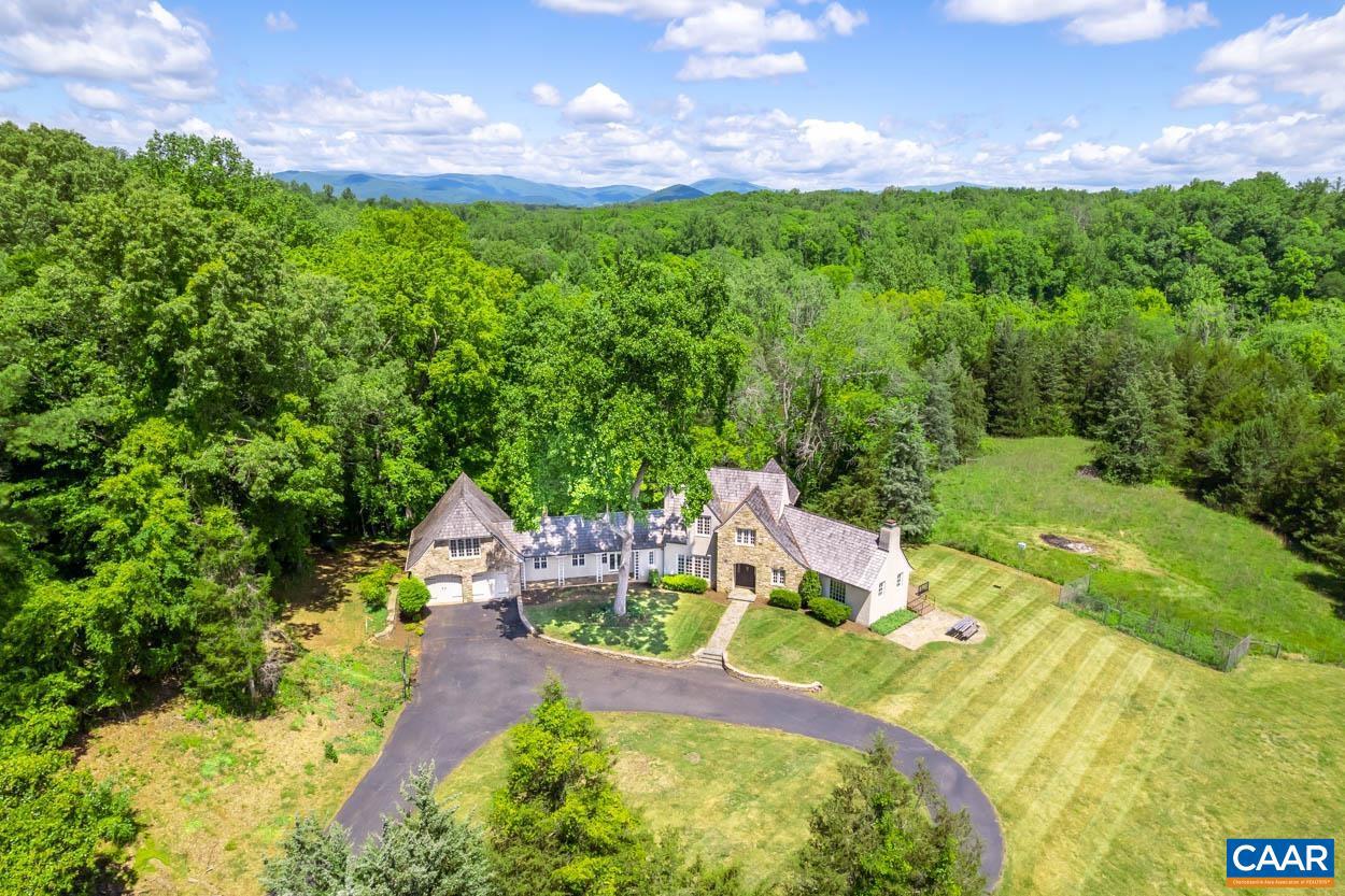 Embrace the charm and potential of this expansive property situated on 108 acres of serene countryside in Albemarle County, located less than 10 miles from Barracks Road and the UVA campus. This unique 3 bedroom, 2.5 bath estate features a structurally sound stone and stucco home with a charming cedar shake roof and copper gutters. The true gem of this property is its backyard access to over � mile of the Rivanna River, featuring a picturesque boulder pool?perfect for both relaxation and recreation by the water. The property also boasts numerous trails for exploring, horseback riding, ATV?s and more.  The property, once a sheep farm, offers a unique opportunity for buyers to add their personal touch. While the home requires renovation, its solid structure and beautiful setting provide an excellent foundation to transform it into your dream property. Additionally, there is a secondary house site located in the middle parcel and a third on the front parcel, providing ample opportunity for expansion.   Experience country living with the convenience of city amenities just a short drive away. Don?t miss this chance to own a piece of tranquility with endless possibilities.,Fireplace in Den,Fireplace in Family Room