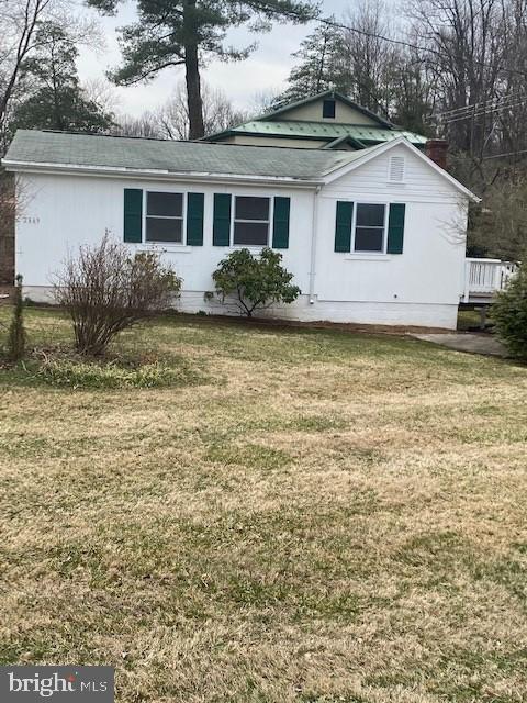 Very well maintained home was newly updated within the last 2 years, with all new flooring throughout, freshly painted, all new kitchen cabinets, sink, granite worktop and new appliances,   Large family room, galley kitchen, bathroom and 2 bedrooms, and bonus room.  Unfinished basement with washer/dryer, filtration/ water softener system, Small deck and steps off the family room leading onto the large yard,  The home sits in a quiet location on Halfway Road and a short drive to shopping and dining.  Grass cutting is included in the rent