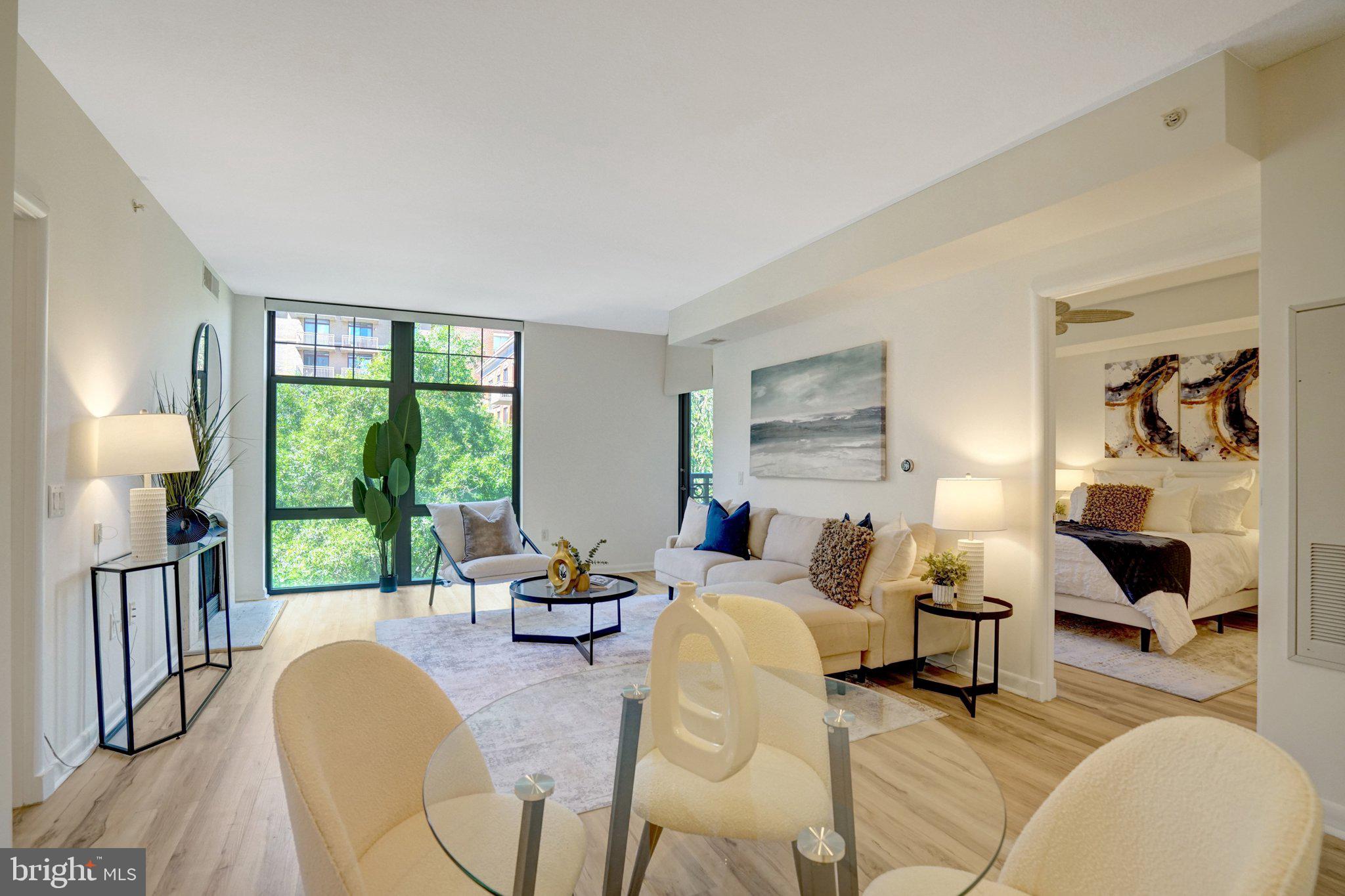 Discover modern luxury living at Clarendon 1021 in the heart of vibrant Clarendon, Arlington. This beautifully updated 2-bedroom, 2-bathroom condo offers 1,137 square feet with a private balcony, two oversized reserved garage parking spaces near an elevator, and a dedicated storage unit.
Just steps from Trader Joe’s and within easy walking distance to Whole Foods, popular coffee shops, and top restaurants, this prime location is also only two blocks from the Clarendon Metro for effortless access to D.C. Easy highway access, nearby dog parks, and excellent schools (Currently zoned for Arlington Science Focus Elementary, Dorothy Hamm Middle, and Washington-Liberty High) complete the appeal.
The building features a recently renovated rooftop pool and grilling area designed for year-round entertainment with stunning panoramic views of the D.C. skyline and Washington Monument. Additional amenities include a well-equipped fitness center, 24-hour concierge, gardens, and resident lounge.
Inside, the light-filled open-concept living and dining area offers floor-to-ceiling windows and custom Hunter Douglas automated roller shades with direct balcony access. The gourmet kitchen features custom white cabinetry with built-in trash/recycling, spice racks, and Lazy Susan corners, quartz countertops, an oversized island, and upgraded appliances including a French door refrigerator and gas range. The home also includes new LVP flooring, recently replaced HVAC and water heater (within the last several years), stackable LG washer/dryer, and Verizon FIOS fiber optic wiring.
The desirable split-bedroom floor plan includes generous walk-in closets in both bedrooms and full en-suite bathrooms. The primary suite features a custom-built barn door and a highly organized custom closet system with sliding tie/belt holders, garment rod, adjustable shelves, and partitioned drawers. A separate mirrored shoe closet and a built-in bookshelf in the second bedroom add extra convenience. Both bathrooms are updated with new quartz, cabinets, and linen closets.
This exceptional condo delivers convenience, style, and outstanding amenities in one of Arlington’s most desirable neighborhoods.
Open House: Sunday, 2:00 – 4:00 PM