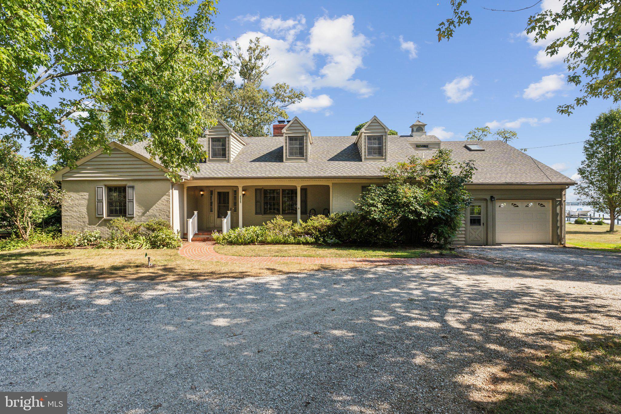 Excellent opportunity to own a charming waterfront house on Riverview Terrace in St. Michaels, Md. This 5BR/ 4BA home is 3300+ SF, has spacious rooms and incredible views of the Miles River. Sited on .95 acres, this property is elevated, has an expansive back yard, and pier with boat lift (being sold as-is). The large waterside deck  provides great entertaining and living space. There are 2  main level bedrooms which share a bath (would make great primary suite) and three large bedrooms with 2 baths upstairs. The dining room has a beamed ceiling, living room has wood burning fireplace and built-ins, and the waterside family room has great river views and a beautiful stone fireplace. Off the  eat-in kitchen is a lovely sunroom, full bath, mudroom, and one car garage. The circular drive provides ample parking and the mature trees give great privacy. No town taxes!