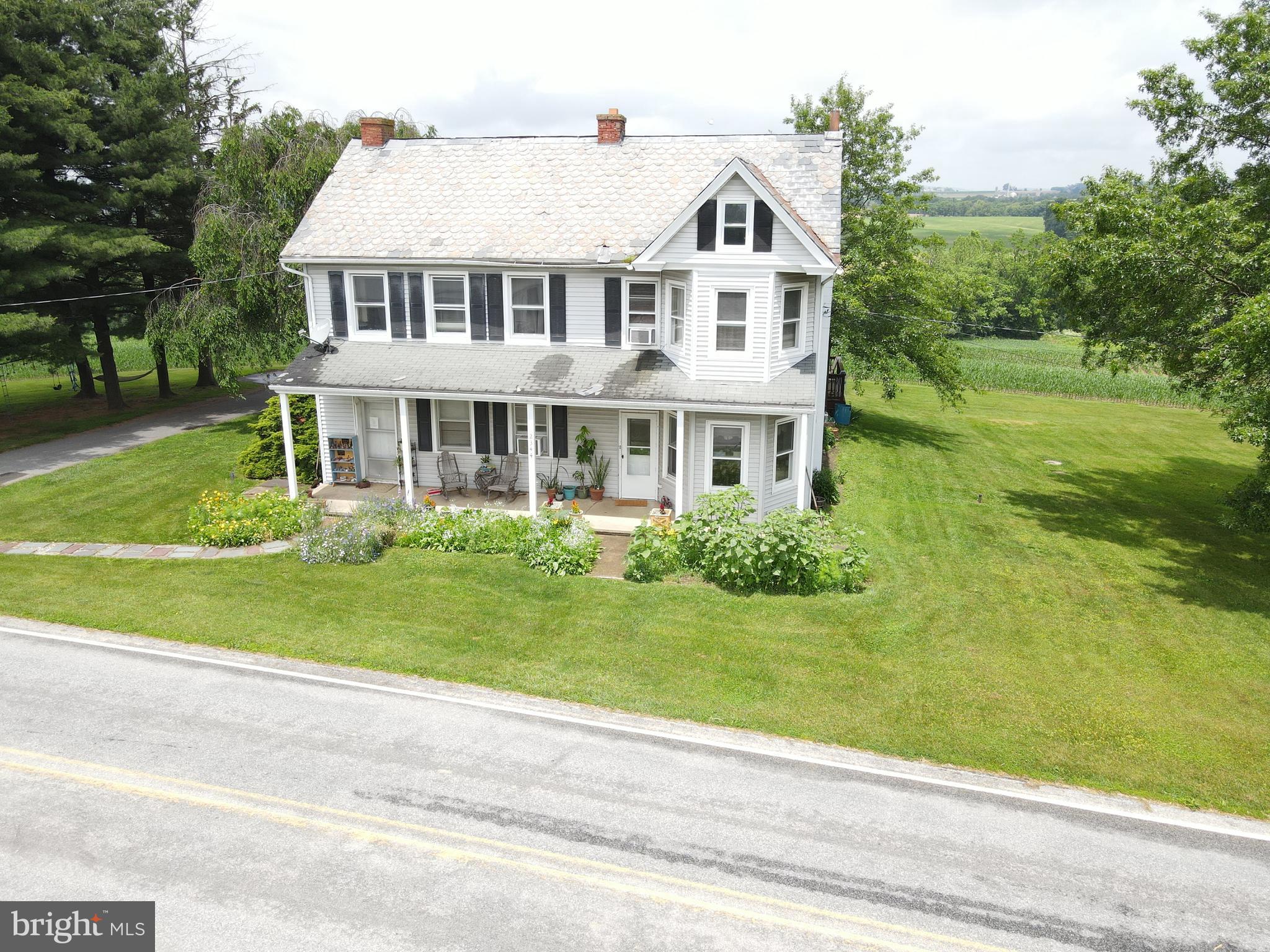 This property will be offered at Public Auction on Friday, September 5, 2025 @ 11am.  The listing price is the opening bid only and in no way reflects the final sale price.  10% down due at auction, 2% transfer tax to be paid by the purchaser, real estate taxes prorated. Set amidst the rolling countryside, this beautiful 68.8-acre farm offers panoramic views and abundant agricultural opportunity. Surrounded by Lancaster County farmland, the property features approximately 60 acres of productive tillable ground, a spacious five-bedroom farmhouse, a classic bank barn, and a storage building. The first floor of the home includes a family room, a large eat-in kitchen, a bonus room currently used as a playroom, a bedroom, a full bathroom, and a laundry room. Upstairs, you’ll find four additional bedrooms, a second full bathroom, and an office or storage room. Additional amenities include an unfinished basement and a covered front porch—perfect for enjoying the scenic setting. This farm is preserved and enrolled in Clean & Green. Don’t miss this exceptional opportunity in the heart of Lancaster County.