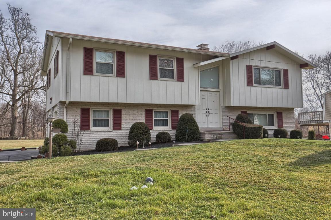 3 bedroom  bi level home in Manheim Township's Foxchase.  Eat in kitchen, master bedroom with master bath and finished lower level with brick surround fireplace in family room. Rear deck and covered patio lead to backyard with mature trees. Convenient location, close to major routes and shopping. See attached features list.