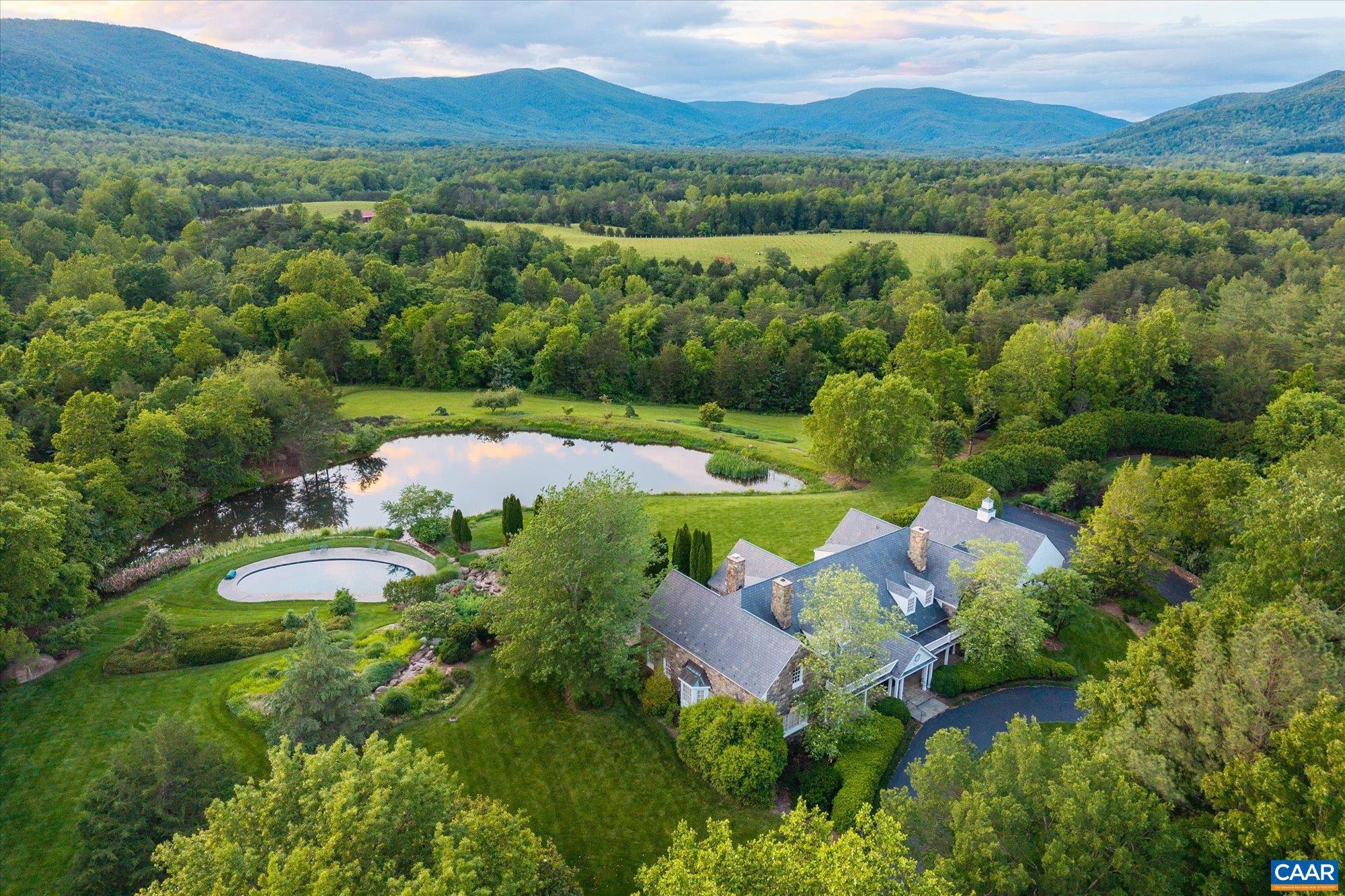 Situated at the foothills of the Blue Ridge Mountains, White Hall Estate  offers a rare blend of natural beauty, viticultural pedigree, and architectural distinction - just 14� miles from the City of Charlottesville. Spanning 212� acres with approximately 48 acres of established estate vineyards within the acclaimed Monticello AVA - recently named the top wine region in the U.S. - this turnkey winery and farm offers  both lifestyle enjoyment & production success. The stone manor home, custom built in 1992, with 5 bedrooms and 4.5 baths, is on a gentle rise, framing absolutely breathtaking panoramic views of the Blue Ridge Mountains & Shenandoah National Park. The over 12,600 sq.ft. winery building is the perfect flex space for a variety of pursuits and is equipped for not only production but also for events. The property also includes a tenant home and numerous outbuildings. A haven for wine enthusiasts, investors, and those seeking an elegant rural retreat, the property combines elevated terroir, proven varietals, and timeless design in a setting of serene grandeur. Whether as a private estate, boutique label, or hospitality venture, White Hall Estate is a legacy opportunity in the heart of Virginia wine country.,Granite Counter,Wood Cabinets,Fireplace in Family Room,Fireplace in Living Room,Fireplace in Study/Library
