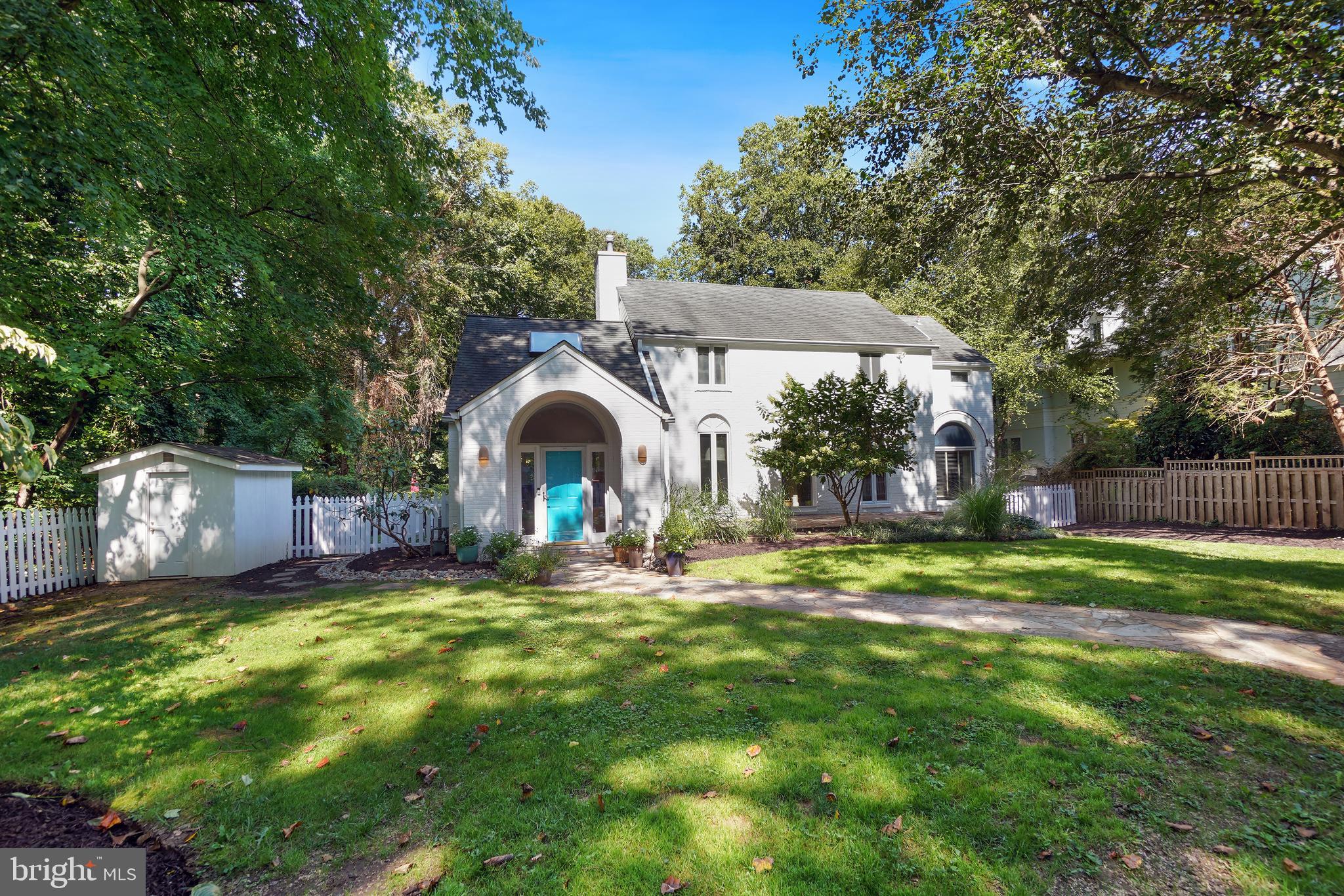 Greeted by a circular driveway and a traditional white picket fence, a serene lifestyle awaits in this light-filled property. Beautifully sited on a park-like lot, this renovated and expanded colonial provides respite from the outside world with its prime close-in location and unsurpassed country-club backyard. The fenced rear yard—abutting county parkland—is a secluded oasis. The porch and multi-level deck overlook a fabulous pool and lush landscaping. Step inside to the glorious piano-sized living room with its cathedral ceiling, Palladian windows, fireplace and exit to the deck and then ascend to the elegant dining room perfect for entertaining. The renovated and expanded eat-in kitchen with its enormous island, catering-style appliances-including a pot-filler over the stove—a pantry and a wine refrigerator is a cook’s dream. Continue the party outside on the adjacent porch or mingle in front of the fireplace in the family room. Move on to the bedroom/den and full bath. With its separate entrance, this space could easily be used as a professional office or an in-law apartment. Upstairs finds a dramatic primary bedroom suite featuring a cathedral ceiling, sitting room, 2-sided fireplace and 2 walk-in stretched closets. The remodeled en-suite bath has 2 vanities, a separate tub and shower and a private commode area. Two more bedrooms and an additional redone bathroom complete this floor. The finished lower level includes a recreation room, full bath and laundry room. A modern main-level powder room, hardwood floors and recessed lights further enhance the interior. Perfectly located in the Whitman school district and in the vibrant Bannockburn community, the MacArthur bike and walking path, the C & O Canal/Towpath, shops, and restaurants are nearby, and easy access to downtown DC, Bethesda, the I-270 corridor and area airports makes commuting a breeze.
