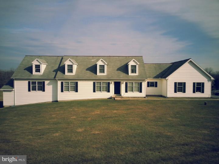 Welcome home to this one of a kind, sprawling cape with almost two acres.  Enjoy the sweeping countryside views from your rear deck. This home boasts neutral d  cor, in law quarters, and an enormous commercial garage in addition to the 2 car attached garage!  Move in ready, but awaiting your personal touches, tremendous possibilities all around!  This is not a drive by.  Call today for your personal tour, this home is truly a unique gem.