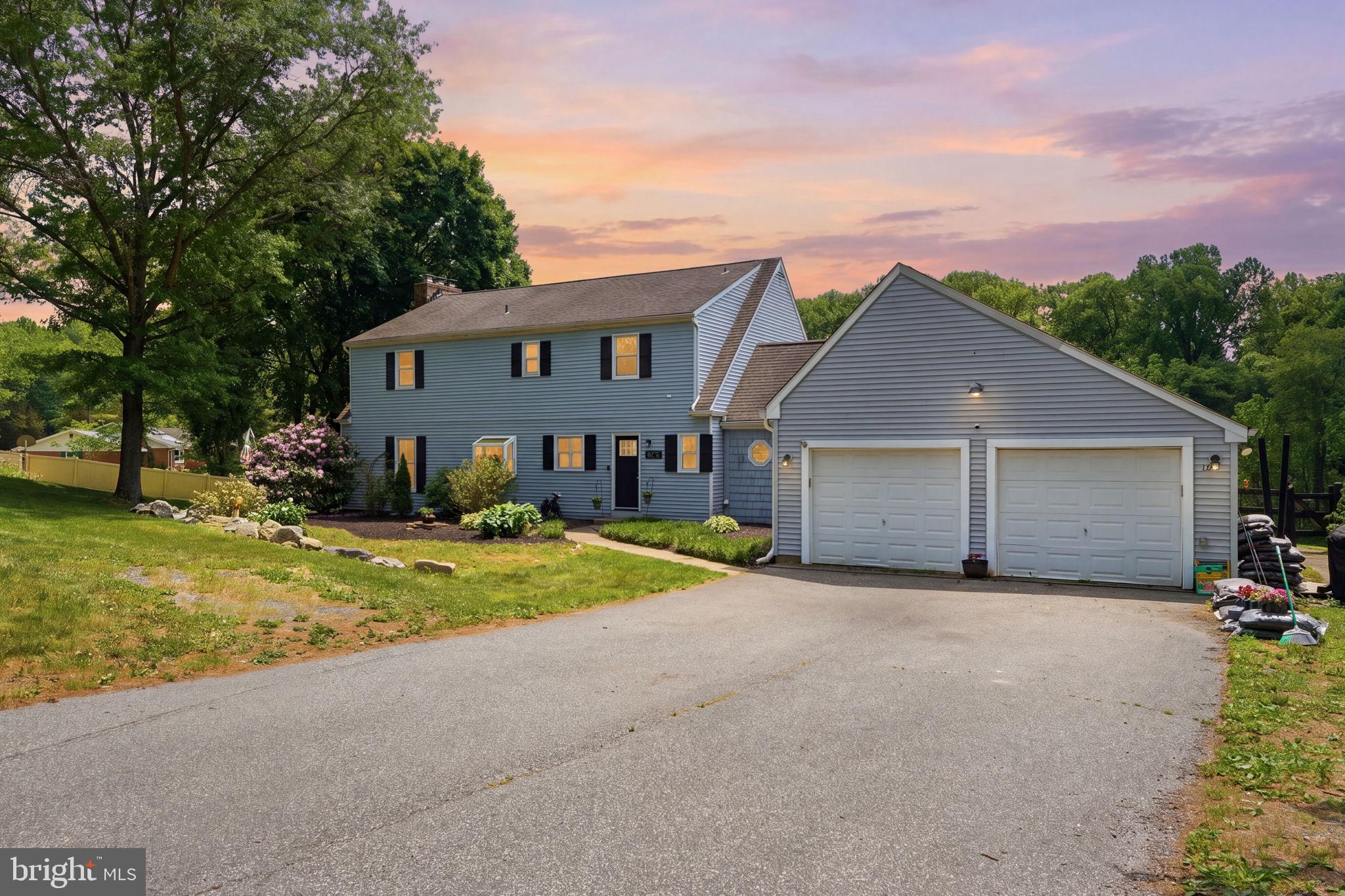 Imagine ending every day with a soft breeze, open land, and a golden sunset- this is what nearly 3 private acres in one of the area's most sought-after locations actually feels like. Minutes from Fair Hill Nature Center, a short drive to Newark's Main Street and the University of Delaware, and an easy shot into Pennsylvania, the setting is rare. But it's the property itself that will stop you in your tracks. Outside, an 18x34 in-ground pool anchors a partially fenced backyard wrapped in mature trees, with a fire pit area, and patio that were made for summer evenings. Inside, the updated main level delivers a cozy country kitchen- granite counters, white cabinets, subway tile backsplash, new plank flooring, and stainless appliances- that flows into a open space eating area and family room with a wood stove and two glass sliders framing stunning rolling hill views. A mud room with vaulted ceilings, wood beams, and custom cabinetry connects to the two-car garage, plus a flexible bonus room works perfectly as a 4th bedroom or home office. Upstairs, the owners suite is anchored by a brick fireplace and barn-style closet doors, with a spa bath featuring a custom tile shower, dual vanity, and soaking tub with brass accents. Two additional bedrooms and a sun-filled loft area- ideal as a reading nook or creative space- round out the upper level. Head down to the basement and you'll find a finished rec room with new carpet and fresh paint, ready to use from day one. A separate unfinished section houses the HVAC and offers serious storage space- the kind that actually keeps the rest of the home clutter-free. Peaceful retreat and entertainer's dream, finally in one place.