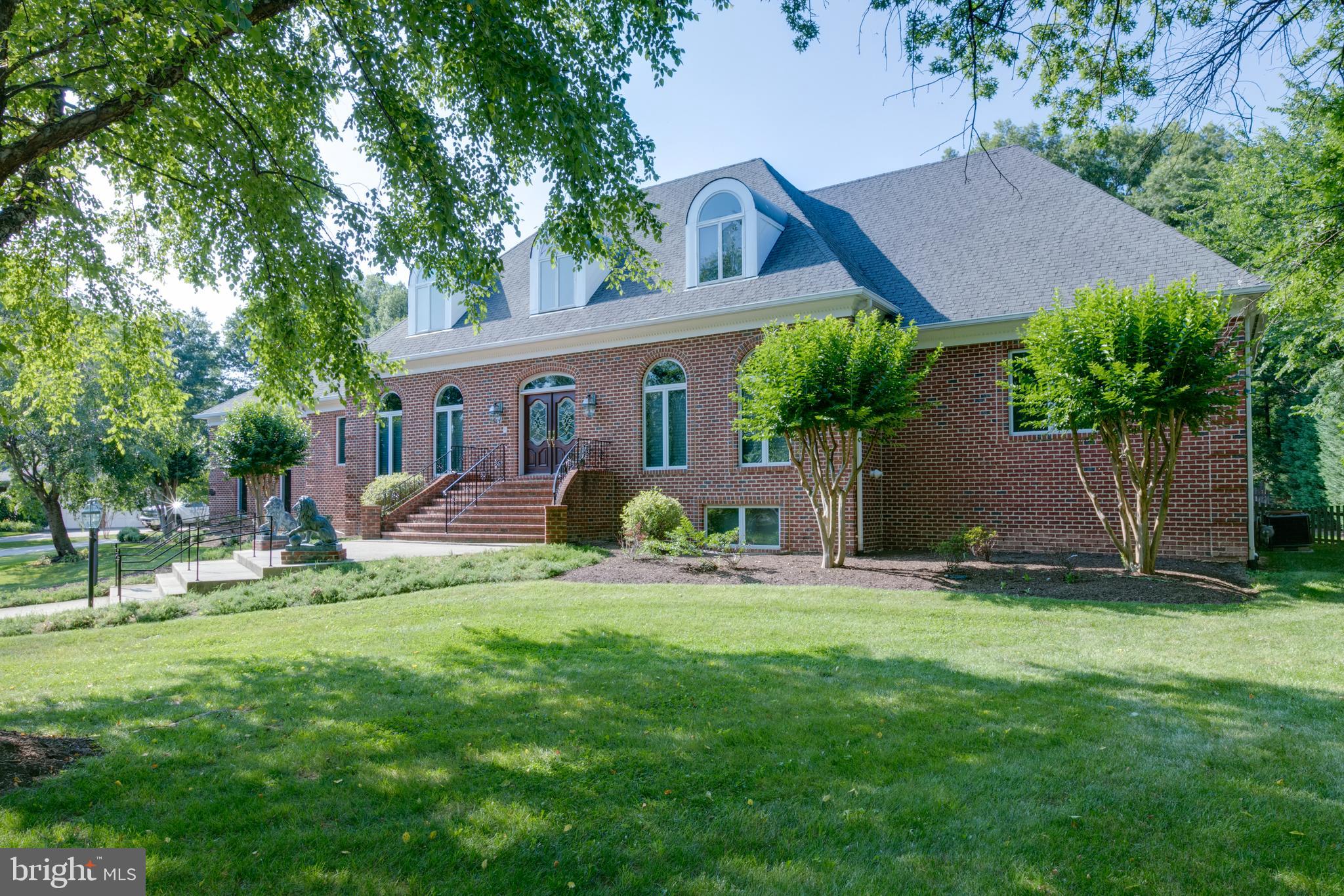 Private beautiful custom all-brick home. Exceptional well-crafted floor plan, soaring ceilings, wood floors throughout, quality materials & craftsmanship. Large kitchen, breakfast room, great room, walk in closets, 3 gas Fp, wide hallways, Beautifully landscaped backyard on more then 3/4-acre perfect for entertaining with full bath in rear patio gazebo, Oversized three car garage with chair lift.
