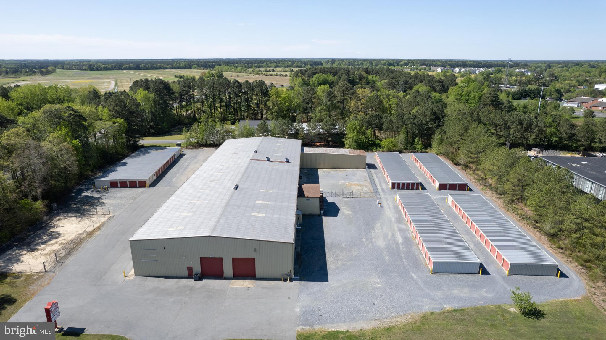 Cambridge - income producing property on 5 +/- acres.  Improvements include a 30,000+/- sq. ft. warehouse/industrial building currently configured into 3 spaces plus a retail showroom (Fire Marshall approved), fully sprinkled, upstairs offices  plus a fenced yard area. Recent bathroom, roof  and HVAC upgrades.  LED lights throughout.  Owner's office features heated floors.
 Additional improvements include  (4) 130' x 30'  mini storage buildings plus a 150' x 55' climate controlled mini storage building, and (4) contractor units running at 95%  to 98% occupancy.  There is an additional fenced storage yard on the property.  Nice signage and recent upgrades to the parking lot.
Just off Rt. 50 on the corner of Rt.16S and Chesapeake Drive.