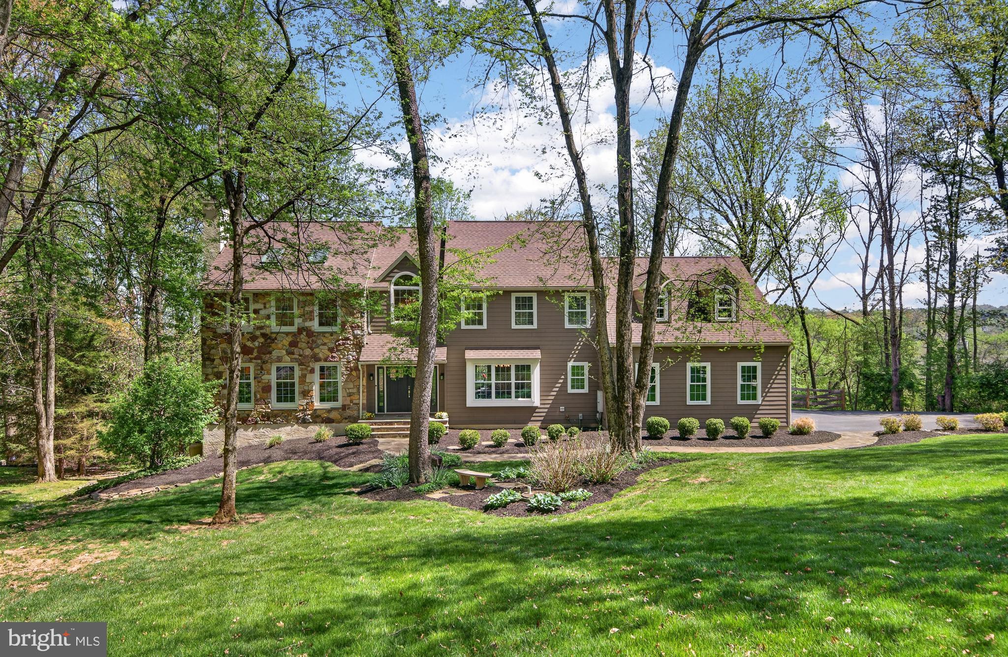 Welcome to 1207 Tullamore, an incredible 4-bedroom, 3.5-bathroom single-family home nestled in the highly desirable Tullamore neighborhood of Chester Springs, within the award-winning Downingtown East and Stem School District. Meticulously maintained and thoughtfully updated, this home offers the perfect blend of comfort, elegance, and everyday functionality—all set on a private and serene 1.1-acre lot with a beautiful wooded backdrop. Buy with peace of mind knowing the home has a new roof, new Hardie siding, new windows, and new doors. Step inside to a grand two-story foyer that sets the tone for the home’s inviting layout. To the left, a formal living room provides a refined space for entertaining, while the formal dining room to the right is ideal for hosting gatherings and special occasions. At the heart of the home, the spacious eat-in kitchen features a large center island with seating and a prep sink, 2 ovens, abundant cabinetry, and a convenient built-in desk. The sunlit dining area, surrounded by natural light from sliding glass doors, opens seamlessly to the back deck—perfect for indoor-outdoor living. The adjacent family room is both warm and impressive, boasting vaulted ceilings, skylights, a cozy fireplace, and a wet bar—an ideal setting for relaxing or entertaining. A private office with custom built-in shelving and tranquil backyard views offers the perfect work-from-home space. A half bathroom and laundry room complete the main level. Upstairs, retreat to the expansive remodeled primary suite, featuring vaulted ceilings, skylights, plush carpeting, and abundant natural light. A large walk-in closet provides ample storage, while the spa-like ensuite bathroom includes double vanities, heated floors, a jetted soaking tub, and a spacious glass-enclosed tile shower. Three additional generously sized bedrooms share a full hall bathroom, and an unfinished upper-level area offers even more storage potential (or great opportunity for a future oversized 5th bedroom and bath!). The finished basement expands your living space with endless possibilities—whether you envision a home theater, gym, game room, play area, or all of the above! A bonus room and full bathroom add flexibility and convenience. Out back, your private oasis awaits. Enjoy peaceful mornings and summer evenings on the expansive deck with long views of the Malvern-Great Valley landscape and beyond. A separate paver patio with a hot tub provides the perfect spot to unwind or entertain guests in total privacy. Experience the best of quiet neighborhood living while being just minutes from local parks including nearby Binky Lee and Bryn Coed trails, shopping, dining, and other local amenities that make Chester Springs such a sought-after location! Enjoy easy commutes with easy access to major roadways like Rt. 202 and the PA Turnpike. This is a home you won’t want to miss!
