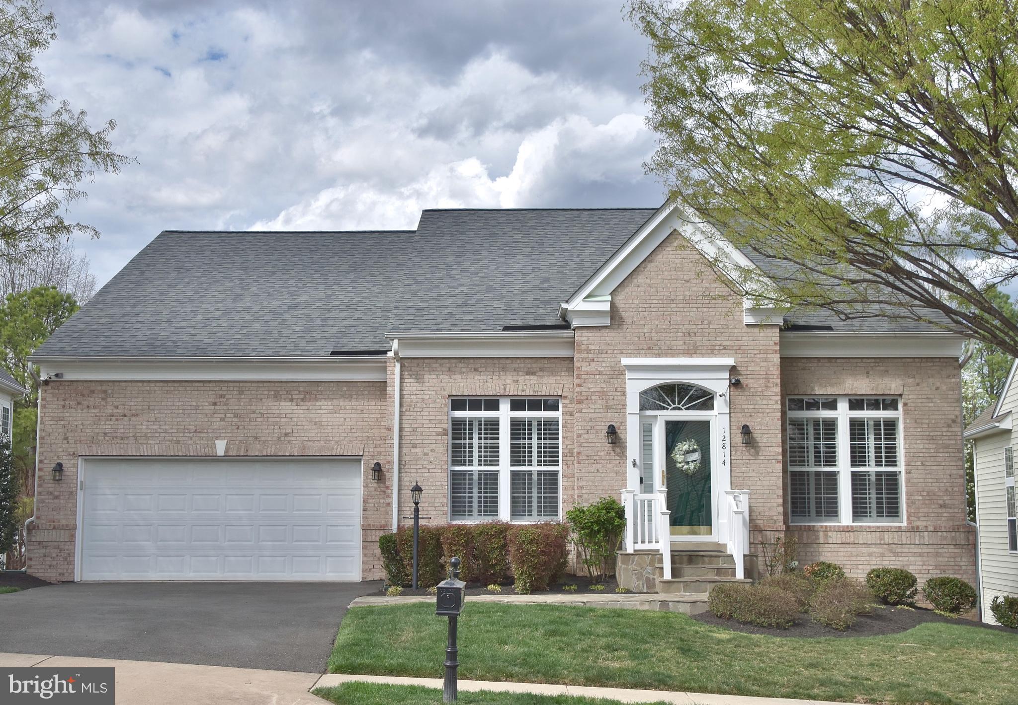 Welcome to the one you’ve been waiting for in the highly sought-after active adult community of Dunbarton. This beautifully maintained Preston model offers three fully finished levels and is filled with thoughtful updates and high-end upgrades throughout. Situated on a premium lot backing to common area, this home showcases true pride of ownership and exceptional attention to detail. As you enter the open foyer, you will notice Canadian Preverco red oak hardwood floors throughout  (2021)! The living room is to your left and dining room on the right. The gourmet kitchen has all stainless steel appliances (2020), granite countertops, under cabinet lighting, and backsplash. From the kitchen, the home opens to a bright breakfast area and an inviting family room featuring a gas fireplace—an ideal space for everyday living and entertaining. This area also provides direct access to a spacious composite deck and a fully fenced rear yard, complete with a beautifully designed flagstone patio (2023). The main-level primary suite is truly exceptional—one of the finest you will see. It boasts a tray ceiling, generous walk-in closets, and a fully remodeled en-suite bath. The bathroom features non slip luxury vinyl plank flooring (2024), a dual vanity with abundant storage, and a custom frameless glass shower. The secondary bedroom is also on the main level near the hall full bath and laundry room. Plantation shutters were installed in 2019 (living and dining rooms). Storm doors installed in 2019. New roof in 2020. The basement is fully finished with an additional bedroom perfect for guests and large rec-room. Check out the custom mirrored built in shelves! You will find oversized windows providing an abundance of natural light and walkout exit to the flagstone patio. The basement luxury vinyl tile was installed in 2024. You will also find a full bath and plenty of additional storage area. The furnace was replaced in 2019. The upper level loft makes for a nice sitting area. It also provides 2 more bedrooms and a full bathroom. The home has been freshly painted. Underground irrigation system. This home truly is a must see!