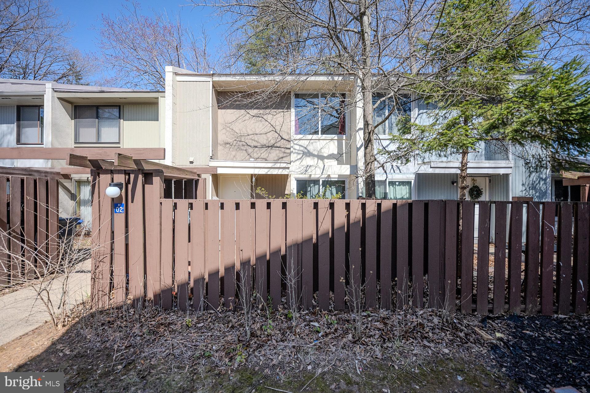 Nestled on a quiet cul-de-sac backing to majestic trees, this 3 bedroom, 1 full, 2 half bath contemporary townhome featuring beautiful new wide plank flooring, plush new carpet, and soft neutral paint throughout is move-in ready! A premium location backing to trees with reserved parking, a private front and rear patio deck, all encircled by privacy fencing, with shade trees beyond creates instant outdoor appeal. Inside, open floor plan, a soft neutral color palette, and large windows are just a few features that make this home so great! ****** Rich wide plank flooring greets you in the open foyer and ushers you into the living room where sliding glass doors fill the space with natural light and open to the spacious fenced rear with deck, the perfect spot for indoor and outdoor entertaining and relaxation! The open kitchen and adjoining dining area is sure to please with an abundance of cabinet and countertop space, quality appliances, and sliding glass doors to the front deck, ideal for outdoor dining. A powder room and a laundry area with full sized washer and dryer rounds out the main level. ****** Upstairs you’ll find the light filled primary bedroom boasting plush carpet, ample closet space, and a convenient and private half bath. Two additional bright and cheerful bedrooms, each with plush neutral carpet, share access to the hall bath with tub/shower. One reserved assigned parking space and one unassigned space completes the comfort and convenience of this fabulous home. ****** All this in a peaceful community with easy access to nature trails that enjoys all the amenities Reston has to offer including miles of trails, community center, outdoor pools, tennis courts, playgrounds, lakes, and so much more! Commuters will appreciate the easy access to major commuting routes including Dulles Greenway, Route 7, the Fairfax County Parkway, and Silver Line Metro. There is plenty of shopping, dining, and entertainment choices in every direction including Reston Town Center just 1.5 miles away. Outdoor enthusiasts will enjoy the many nearby parks! For a wonderful townhome in an excellent location, this is it!