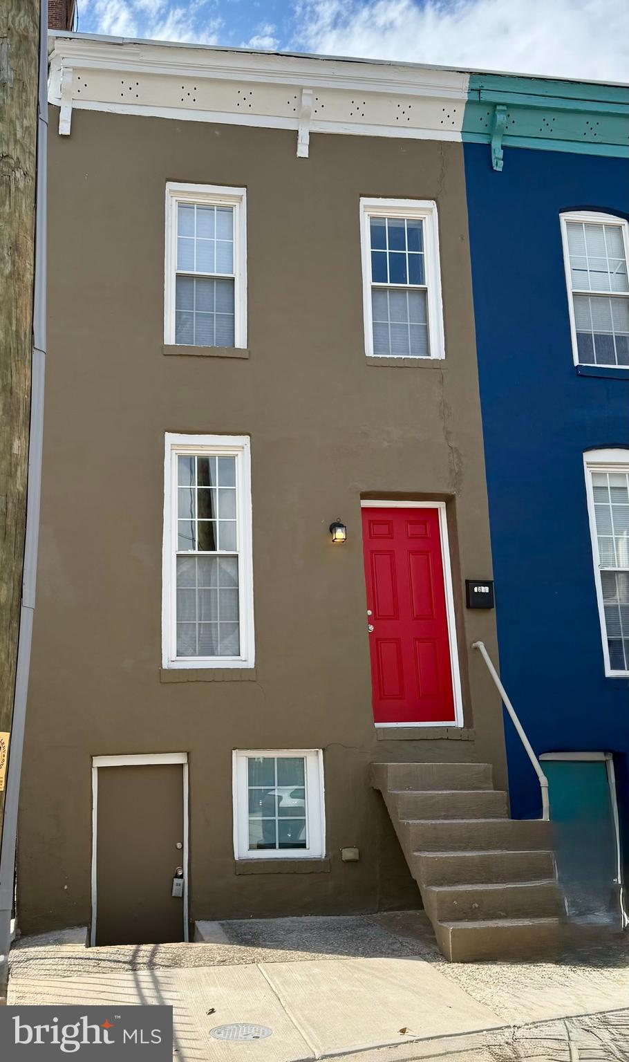 This stylish end-unit rowhouse in Baltimore’s vibrant Greenmount West neighborhood combines modern updates with classic charm in a compact, efficient layout. With approximately 1,000 square feet, this one-bedroom, one-bath home is perfect for anyone seeking low-maintenance city living in a highly walkable area.

Renovated approximately seven years ago, the interior features an industrial-modern design with exposed brick and ductwork, plus sleek finishes throughout. The kitchen boasts stainless steel appliances—including a gas range, range hood, dishwasher, and refrigerator—paired with contemporary cabinetry, some with glass-front doors for added style. The second floor includes a laundry room, a comfortable bedroom, and a versatile office space.

The basement has been converted into a home gym and is home to the mechanical systems. Outside, a private fenced backyard with a fun patio offers the perfect spot for entertaining or enjoying your own outdoor escape.

Schedule your appointment to tour this modern end unit in walkable Greenmount-West today!