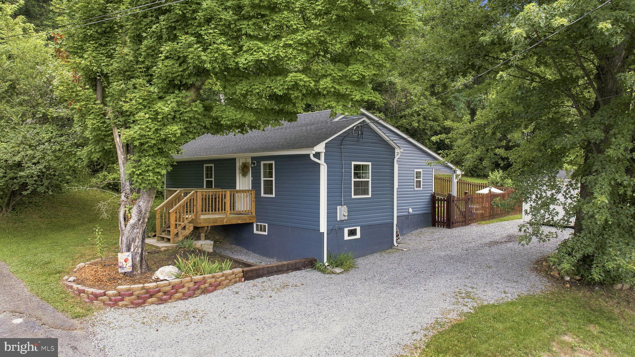 Here is my idea for the remarks!
Welcome to 96 George Lane, Berkeley Springs, WV 25411—a beautifully maintained 2-bedroom, 2 full-bath bungalow offering the perfect balance of charm, comfort, and convenience. This well-maintained home features 880 square feet of thoughtfully designed one-level living, making excellent use of every inch of space. Whether you're a first-time homebuyer, looking to downsize, or searching for a low-maintenance retreat, this home is sure to impress. Luxury vinyl plank flooring extends throughout most of the home, adding both durability and a modern touch to the warm and inviting interior. Situated on 0.22 acres, the property offers a wonderful outdoor space with a partially fenced backyard, perfect for entertaining, pets, or simply enjoying the peaceful surroundings. Beyond the fenced area, you'll find additional yard space complete with a chicken coop, providing endless possibilities for gardening, hobby farming, or creating your own backyard oasis. Inside, multiple energy-efficient mini-split systems provide personalized heating and cooling for year-round comfort and efficiency.Perched in a desirable location just above Berkeley Springs High School, this home is only minutes from shopping, restaurants, schools, and the charm of historic downtown Berkeley Springs. Enjoy the convenience of nearby amenities while taking advantage of everything this historic spa town has to offer, including its famous warm mineral springs, unique local boutiques, art galleries, dining, and year-round community events. Combining pride of ownership, modern comforts, and an unbeatable location, 96 George Lane is truly move-in ready and waiting for its next owner.Don't miss your opportunity to own this well-maintained 2-bedroom, 2 full-bath bungalow! Reach out today to schedule your private showing and experience everything this wonderful home has to offer!