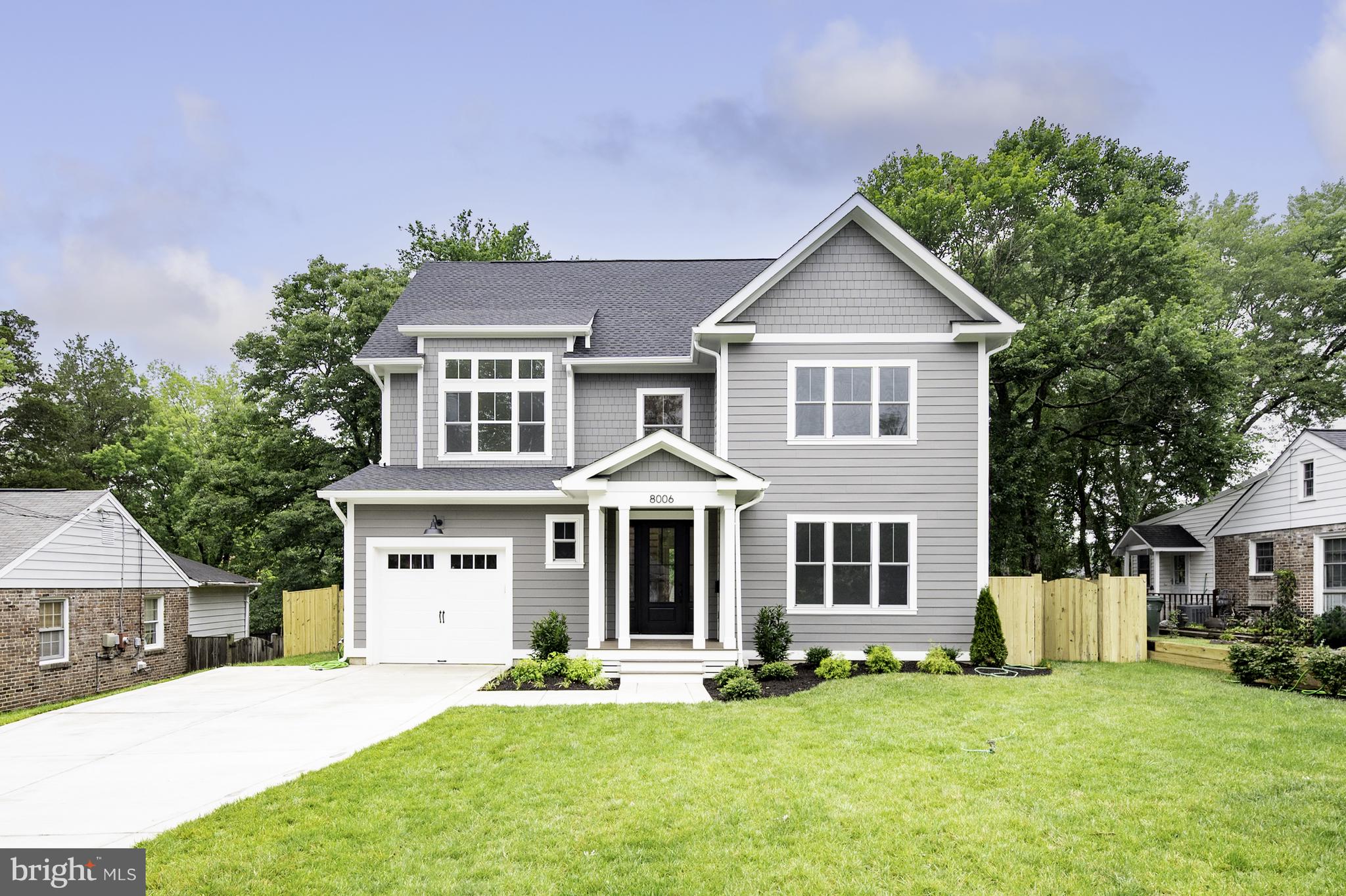 Beautiful Custom Home by Reputable Local Builder with over 30 years of experience, located in the sought-after Waynewood Elementary School District. With 3,500 finished square feet, this one-of-a-kind, energy-efficient, 3-level home features 5 bedrooms, 4.5 baths, and a garage.
FIRST FLOOR: Features a main floor bedroom with a full ensuite, including a barrier-free shower, to keep your guests comfortable in their private area. A powder room, a mudroom including custom cubbies, a large walk-in pantry, and access to the garage and side yard. A light-filled open-concept kitchen//family/dining room with a large gas-burning fireplace, flanked by built-in bookshelves. French doors lead to a large deck with a permanent gas hookup for grilling. A chef’s kitchen with plenty of storage, shaker-style cabinets, a custom hood, quartz countertops, tiled backsplash, a large farmhouse sink, and an island with seating for 4.
SECOND FLOOR: Includes a private owner’s suite, with a large walk-in closet, gorgeous bathroom with soaking tub, large glass-enclosed shower, and a custom double sink vanity. Two additional large bedrooms, one with a vaulted ceiling. A hall bath with a double sink vanity area that can be closed off from the toilet/tub/shower area for easy sharing. Off the second-floor hallway, find a large storage closet and a laundry room with natural light, sink, custom cabinetry, and quartz countertops.
THIRD FLOOR: Features a large bonus recreation room, full bathroom, bedroom/office area, and accessible attic storage.
INCLUDED UPGRADES: This quality home features 9’ ceilings, MI Windows, engineered hardwood flooring, solid-core interior, and barn doors, 2 separate Carrier Heating/Air Conditioning zoned systems, a tankless water heater with infinite hot water, CAT-6 wiring with multimedia outlets, Hardie-plank siding, and a lifetime architectural shingled roof. Plus, the garage is wired for electric car charging.
PERFECT LOCATION: Located on a quiet street in Hollin Hall, convenient shopping and dining are
 within walking distance. Lots of parks, pools, and pickleball courts nearby. Just minutes from the George Washington Parkway with easy access to Old Town, DC, Reagan International Airport, and Hwy 495.