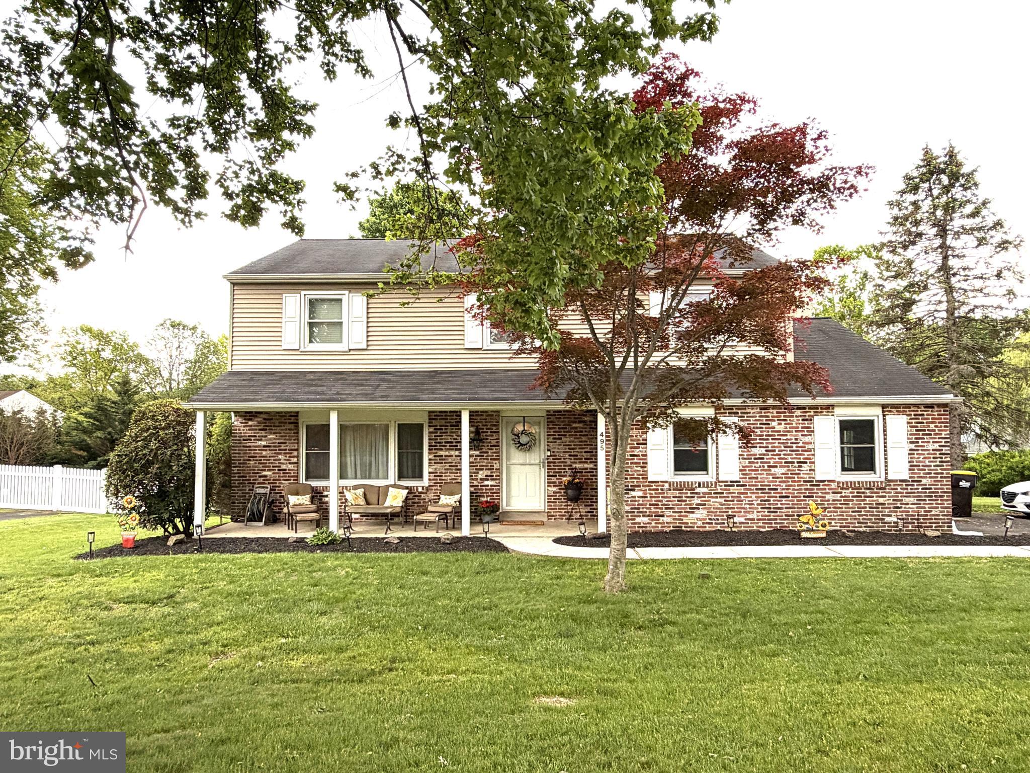 You can't beat this location! Just a short walk to Historic Downtown Newtown Borough. This 4 Bedroom, 2 1/2 Bath Colonial features an open Kitchen (26 ft long) that extends into the sunny eating area. The Kitchen has white Shaker style cabinets, large center island with seating and granite counter-tops, stainless steel appliances, bow window in eating area and wood floors.  There is a beautiful Sunroom with new windows that leads to the Trex syle deck. The Family room has a wall to wall brick fireplace.  All bedrooms are very spacious. Newer carpets and freshly painted neutral colors throughout. Replaced HVAC (2016) and new water heater. The Laundry room is on the main floor with an entrance to the 1.5 car side entrance  garage. The basement is unfinished and waiting for your personal touch.  This house is in move-in condition! Council Rock Schools!