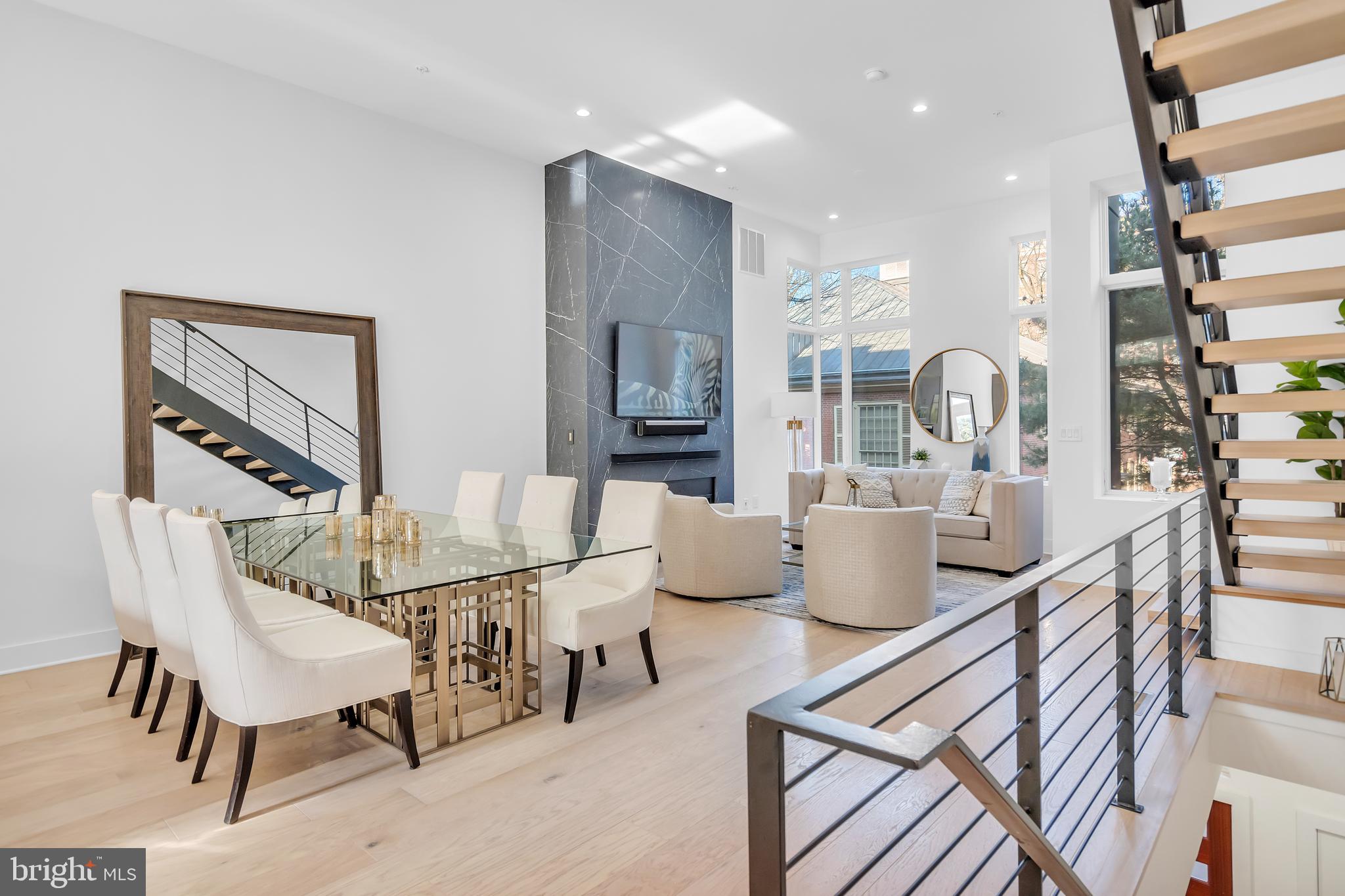 This stunning home is a must see! Welcome to 48 N 3rd Street in the heart of Old City. This home is enclosed in a gated community with a private entrance which is the perfect oasis away from the hustle and bustle of the city and backs up to a historical site. Enter the home through the front door from a private lane or through the 2-car garage. Once inside you will be blown away by the open concept floor plan that is perfect for entertaining. The beautiful floor to ceiling quartz fireplace, with a steel mantle, was recently installed. The contemporary, light-filled space flows seamlessly to the gourmet chefâs kitchen with state-of-the-art Wolf/Sub-Zero appliances, granite countertops, and access to a private balcony which is lined with custom planter boxes, equipped with an irrigation system. The second floor features two large bedrooms with custom walk-in closets and en-suite bathrooms. A full-size laundry room is also on this floor. Upstairs on the third floor, enjoy the gorgeous primary suite which boasts a generous walk-in closet, newly installed motorized window shades, and a spa-like bathroom featuring custom tiling, a double vanity, a free-standing soaking tub, and a large glass enclosed shower. Take the private elevator up to the roof deck where you will find a newly installed outdoor kitchen and beautiful views. The pilot house is also equipped with a wet bar, lounge area, and half bath. For additional living space, this home has a finished basement with a newly installed video wall with built-in speakers, a full bath, and extra storage. With gorgeous hardwood floors throughout, high ceilings, an elevator, speaker system, and an alarm system, what more could you ask for? Enjoy being within walking distance of the shops and restaurants in Old City. The tax abatement on this home expires on December 31, 2028.